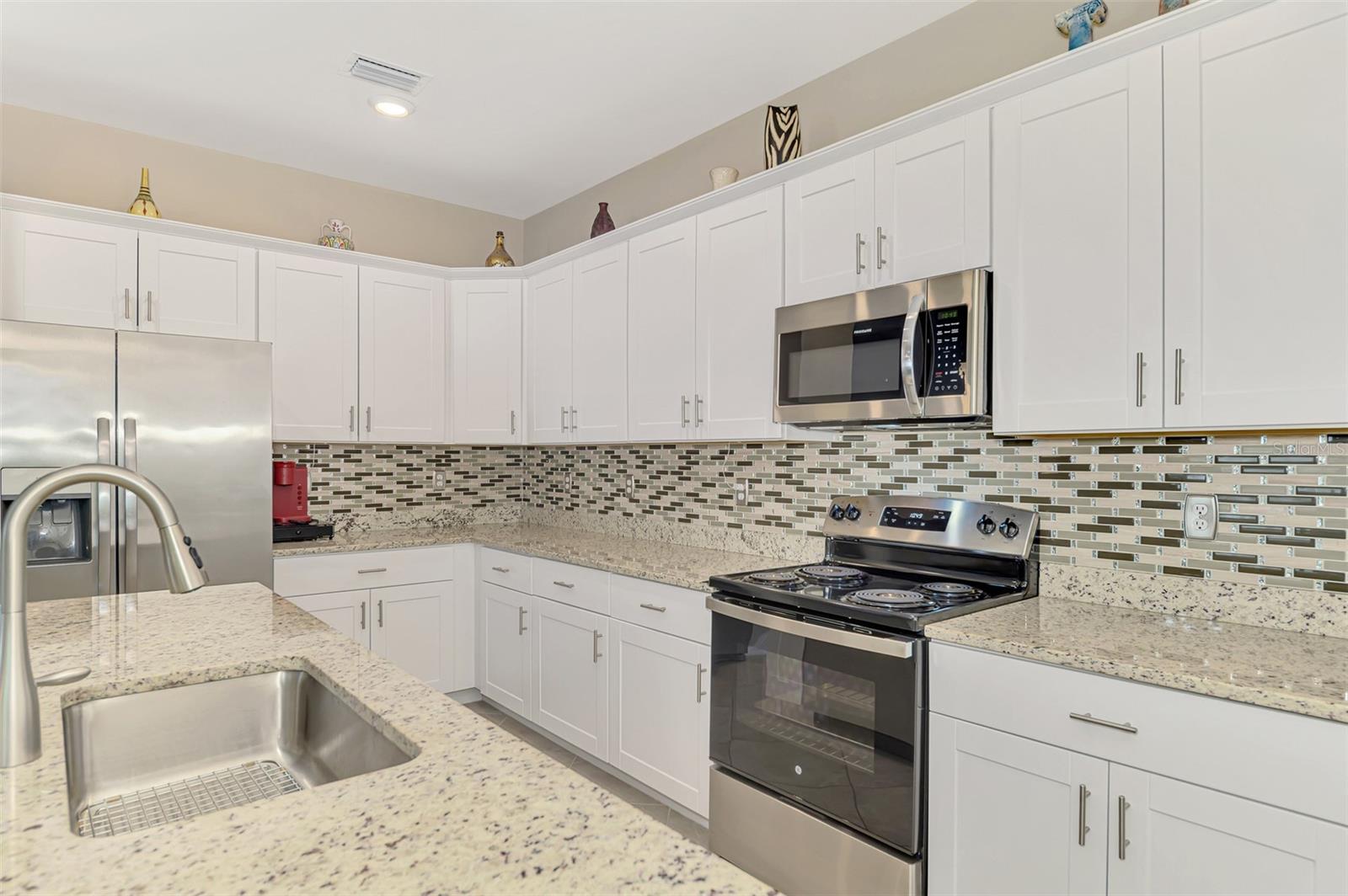 Look at all that counter space for entertaining and cooking - 1932 W ISLES RD, PORT CHARLOTTE