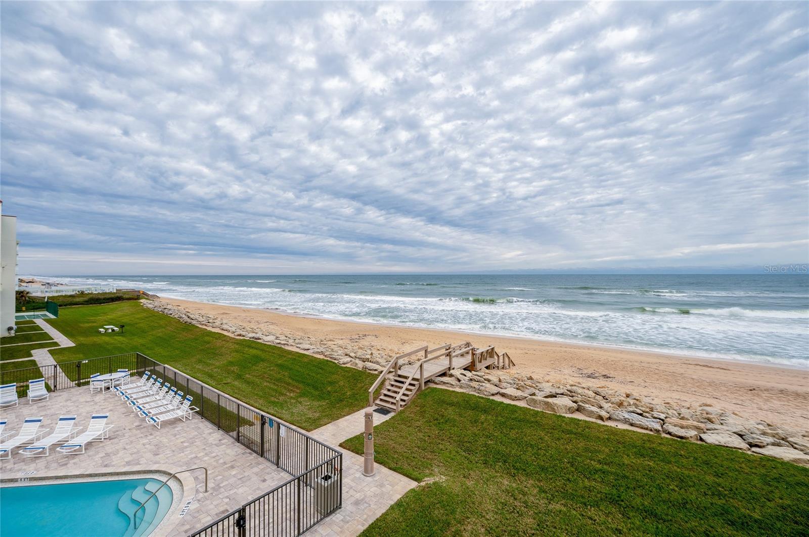 Direct beach access from the building leads to soft sand and surf just steps from your door—coastal living at its finest. - 6727 TURTLEMOUND RD #315, NEW SMYRNA BEACH