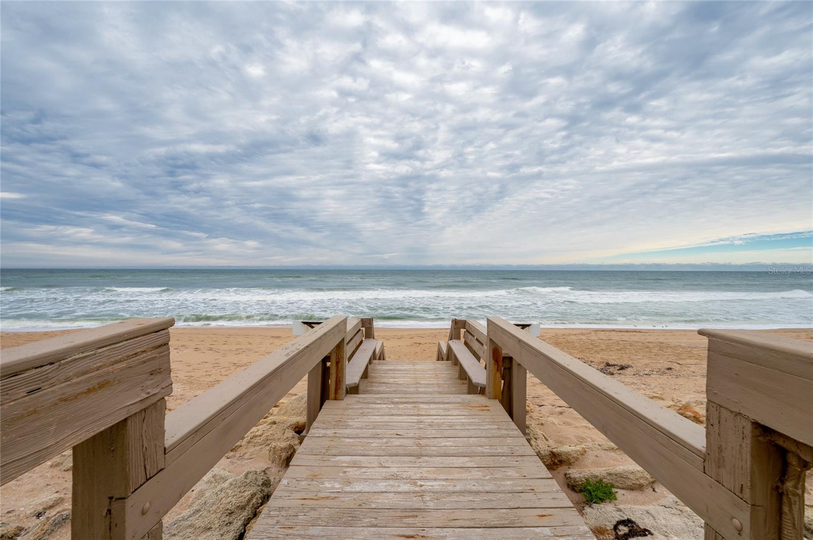 A private boardwalk leads directly from the community to the sandy shoreline, offering effortless access to the beach just steps from your door. - 6727 TURTLEMOUND RD #315, NEW SMYRNA BEACH