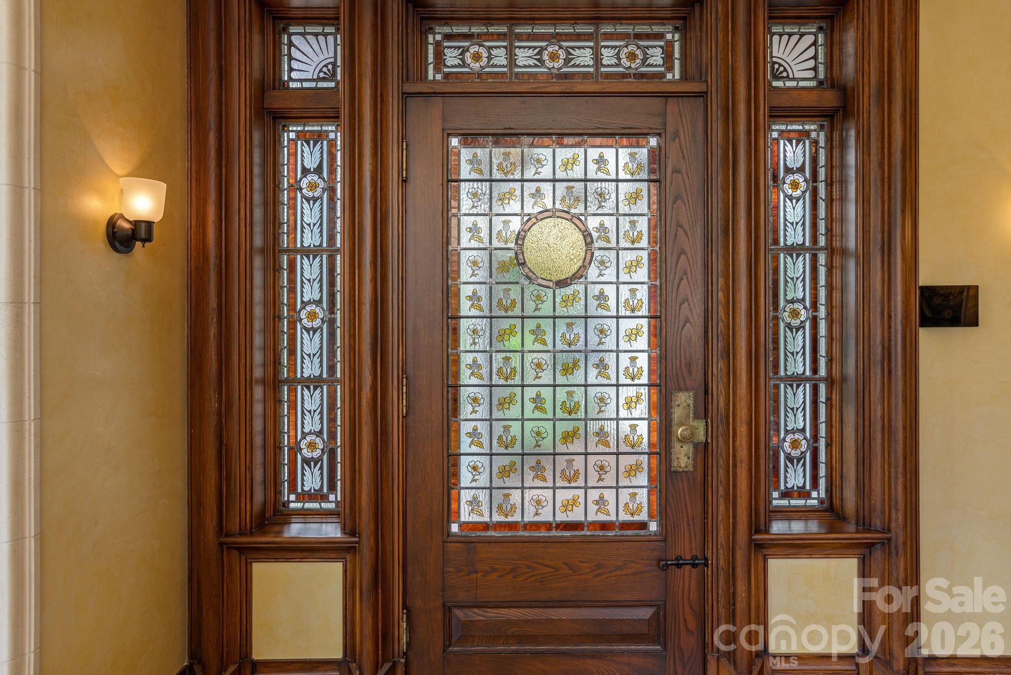 William Morris-inspired leaded glass entry doors. - 8 Fairway Place, Asheville