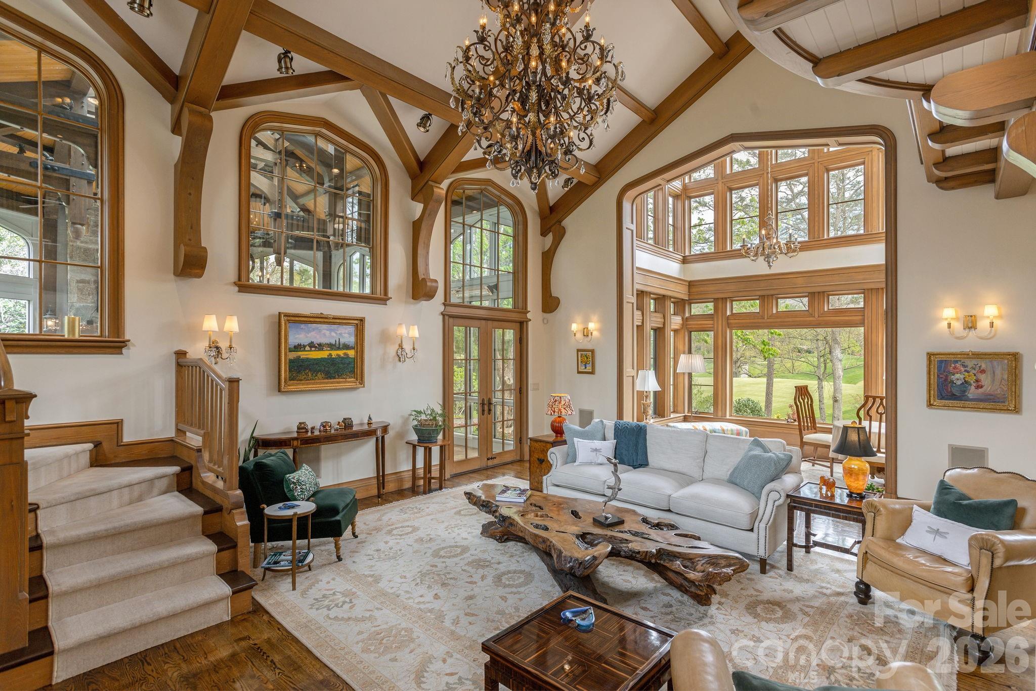 Great room opening to the two-story atrium - 8 Fairway Place, Asheville