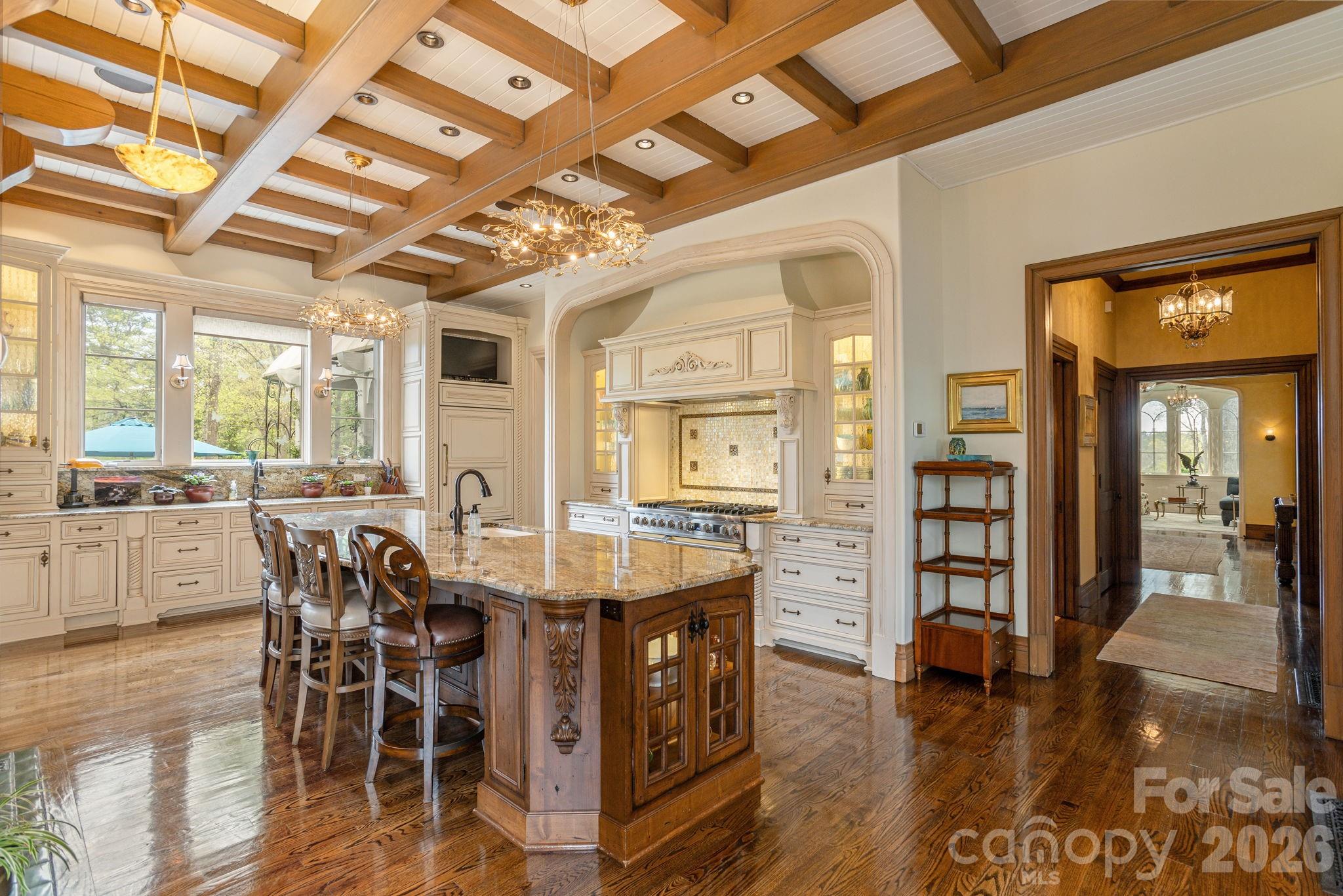 French country inspired chef's kitchen with custom cabinetry and premium appliances - 8 Fairway Place, Asheville