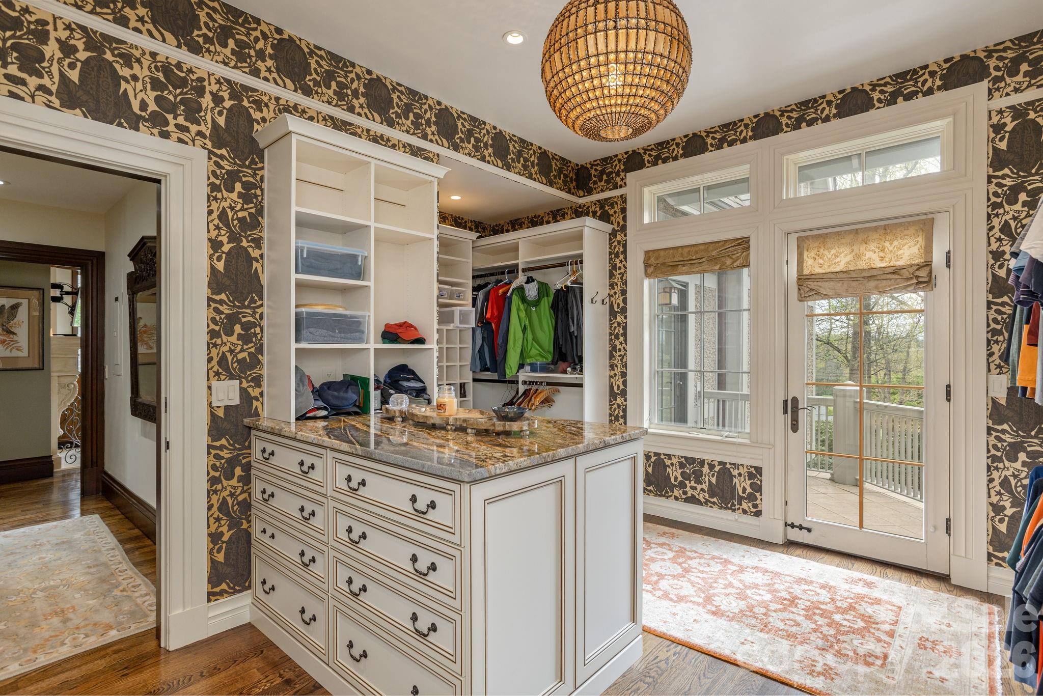 Primary dressing room and custom closet with a balcony. - 8 Fairway Place, Asheville
