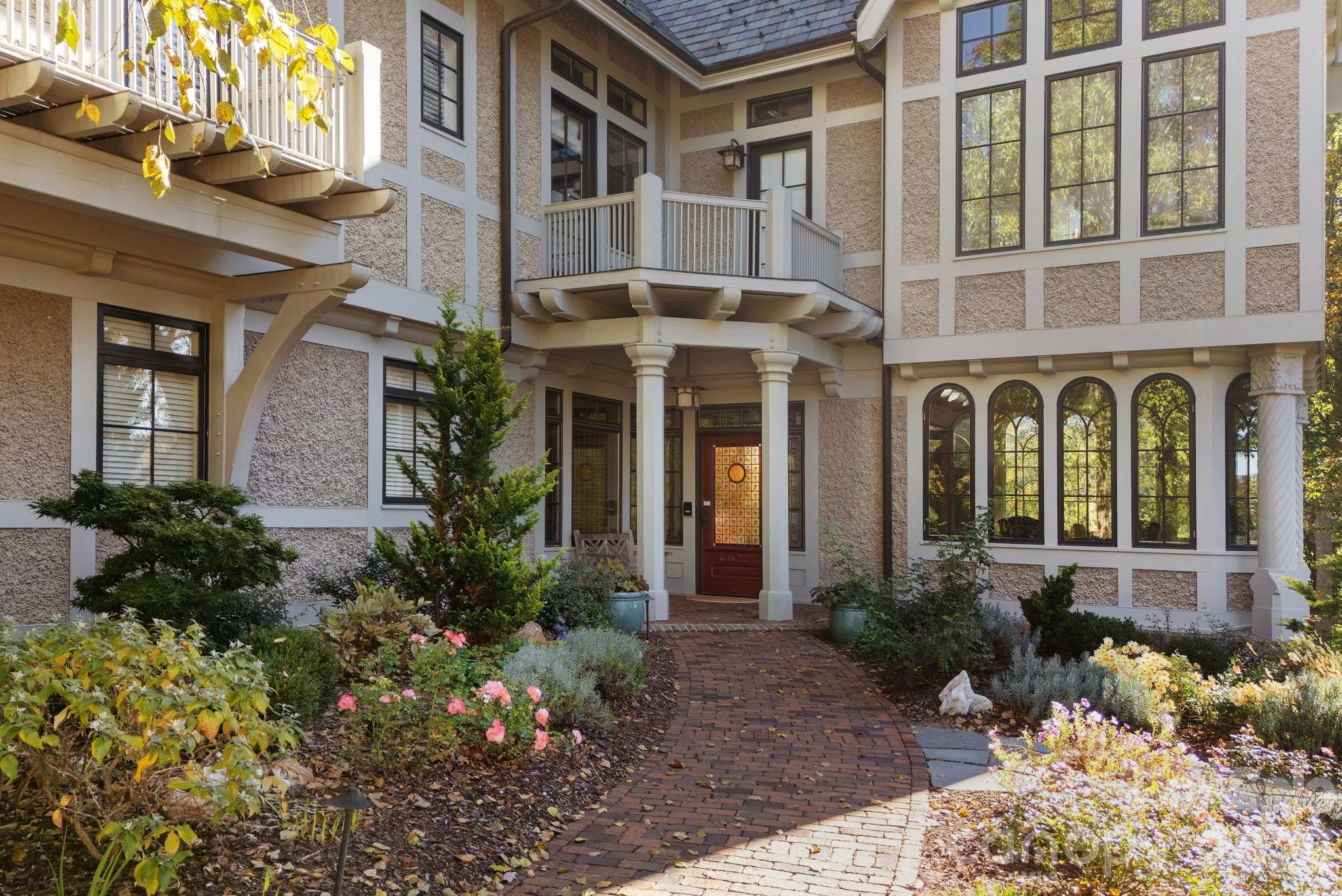 Stately front entrance framed by perennial gardens - 8 Fairway Place, Asheville