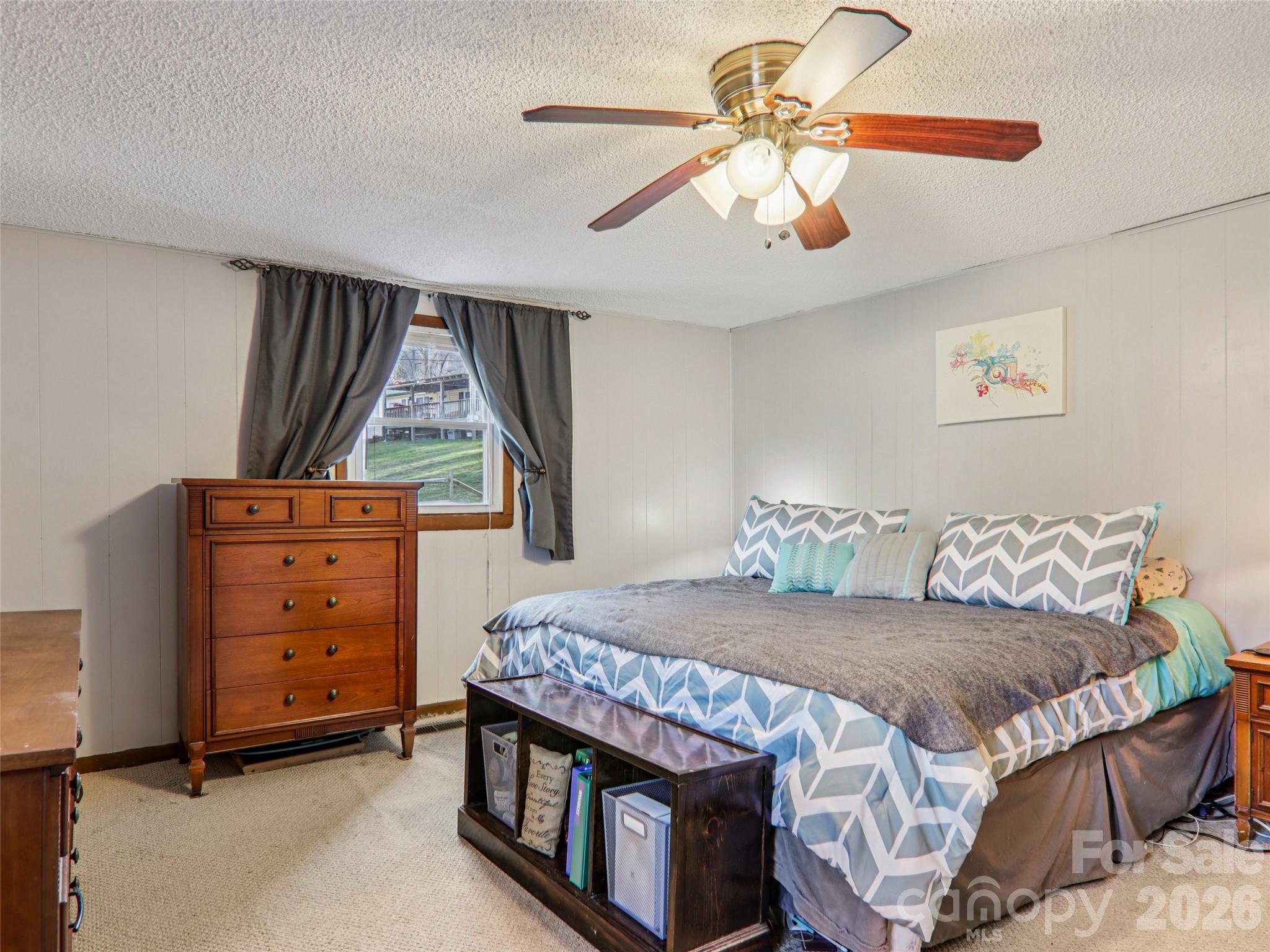 Alternate view of the primary bedroom with two windows providing natural light (one window shown) - 7 Landon Mountain Lane, Weaverville