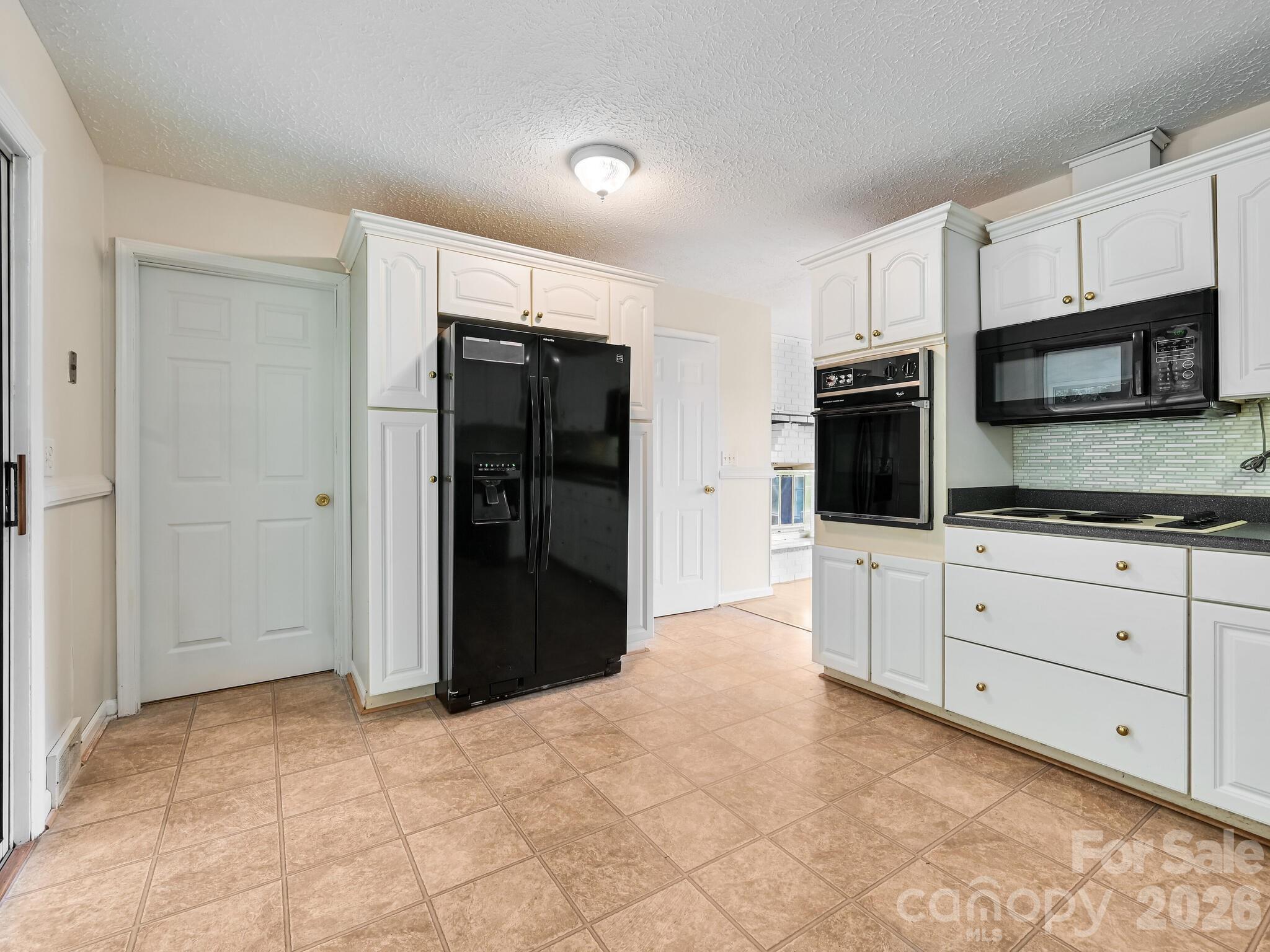 Door to laundry room off of kitchen - 651 Case Cove Road, Candler