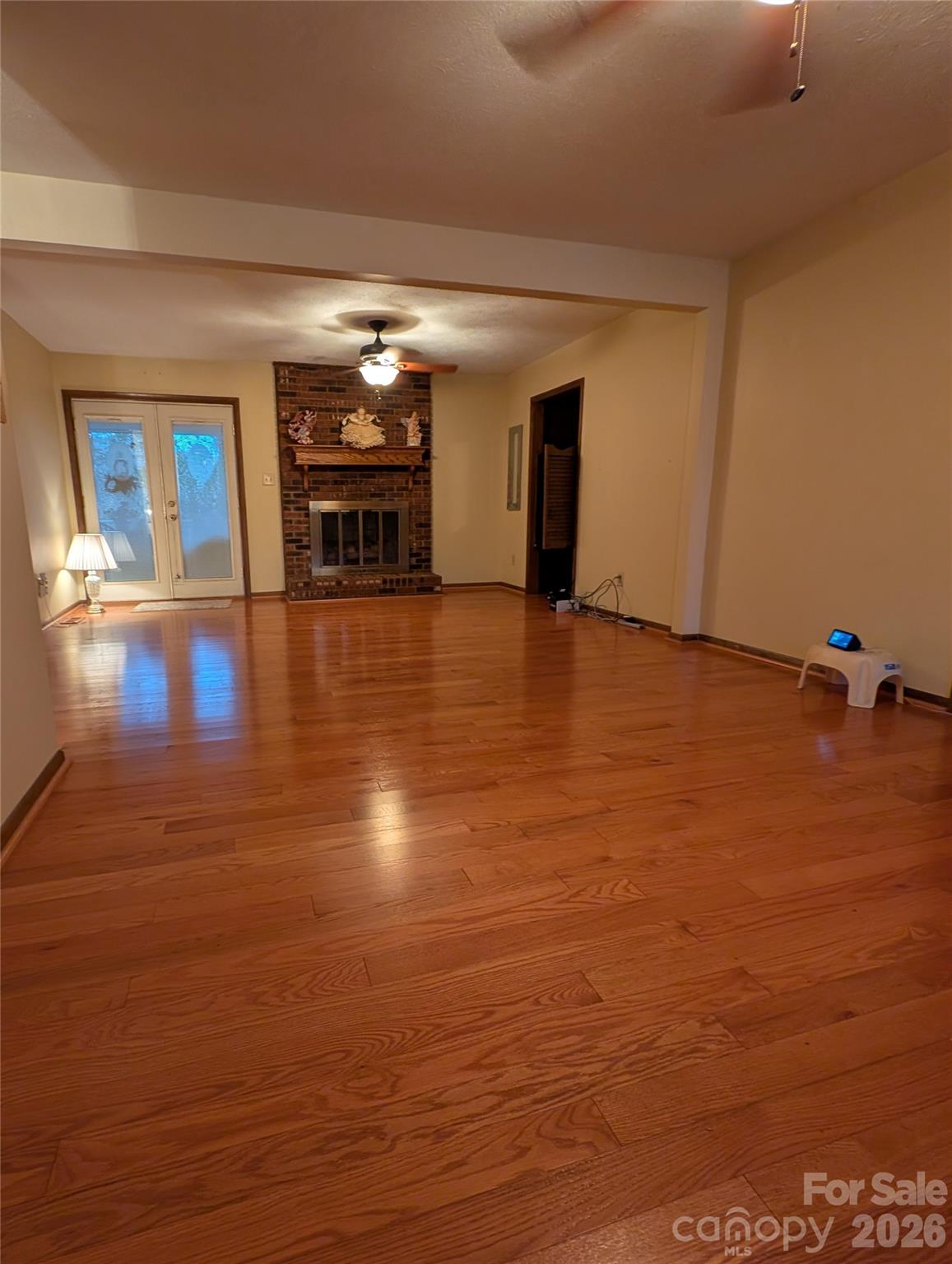 family room with pre finished wood floors and gas fireplace - 3065 Woodstream Drive, Valdese