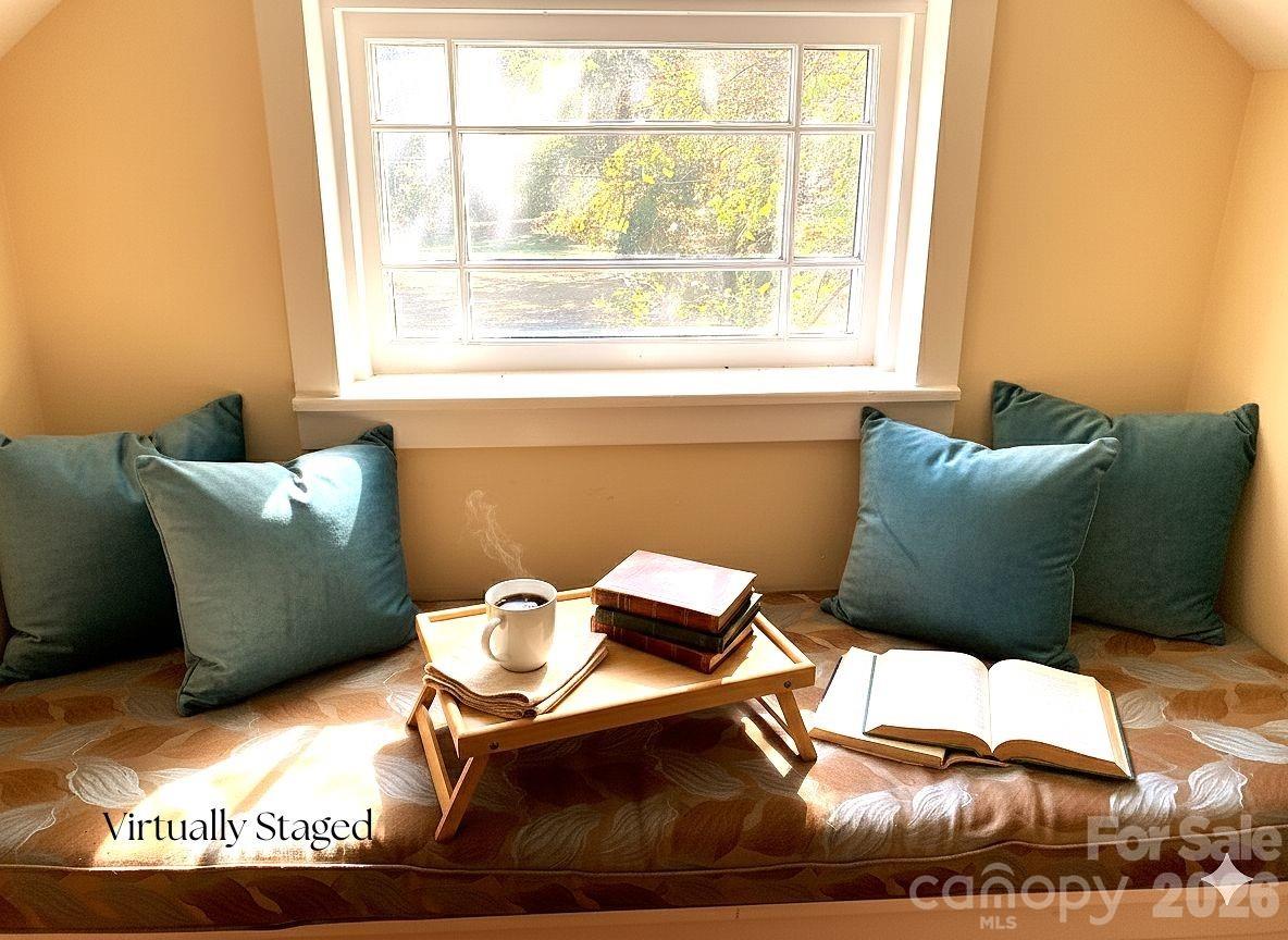 Quaint window seat in primary bedroom is ideal for morning coffee or a chapter or two before starting your day. - 1051 Pee Dee Avenue, Albemarle