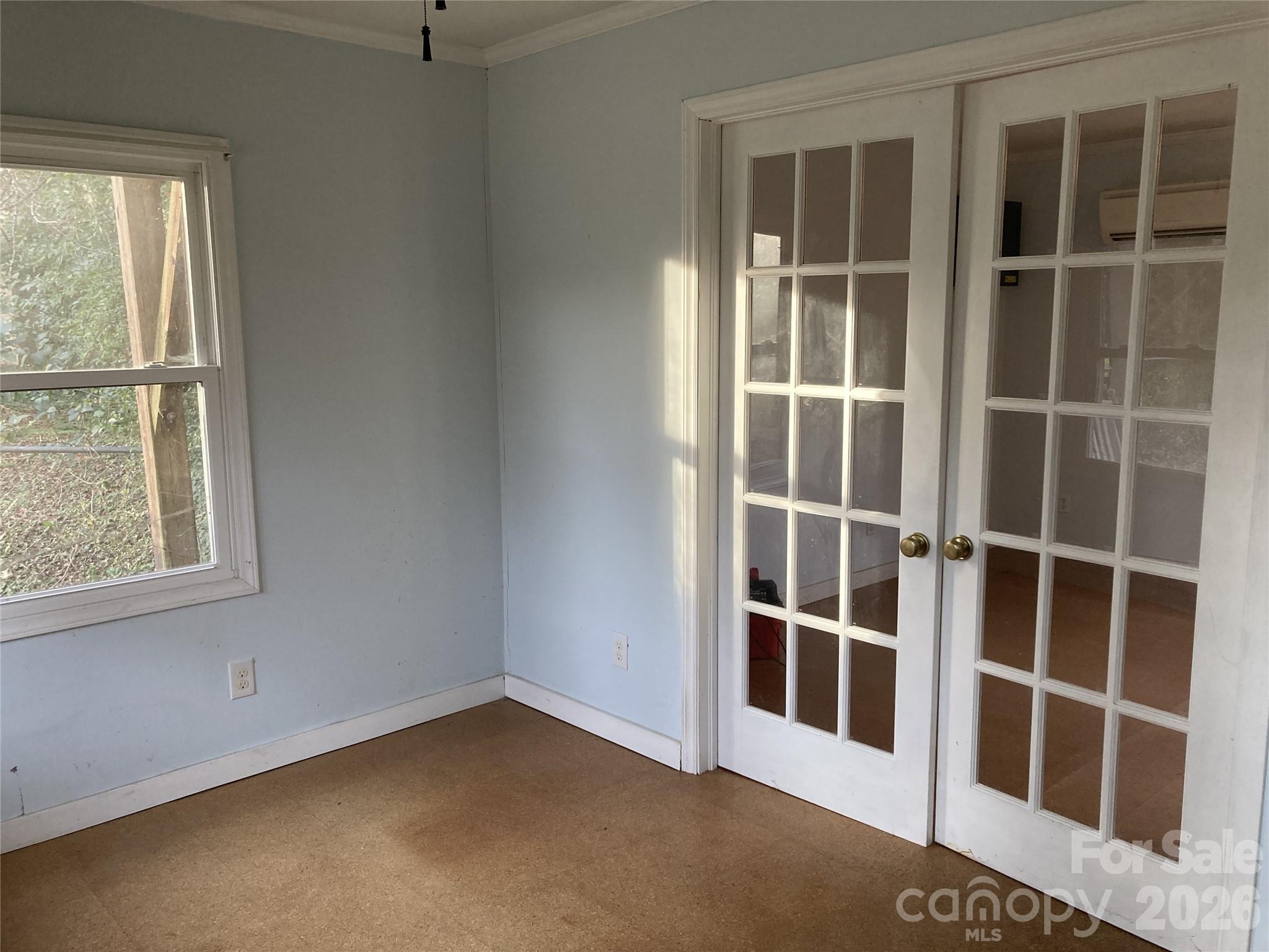 ADU living space with french doors with stairs leading to sleeping loft. - 1051 Pee Dee Avenue, Albemarle