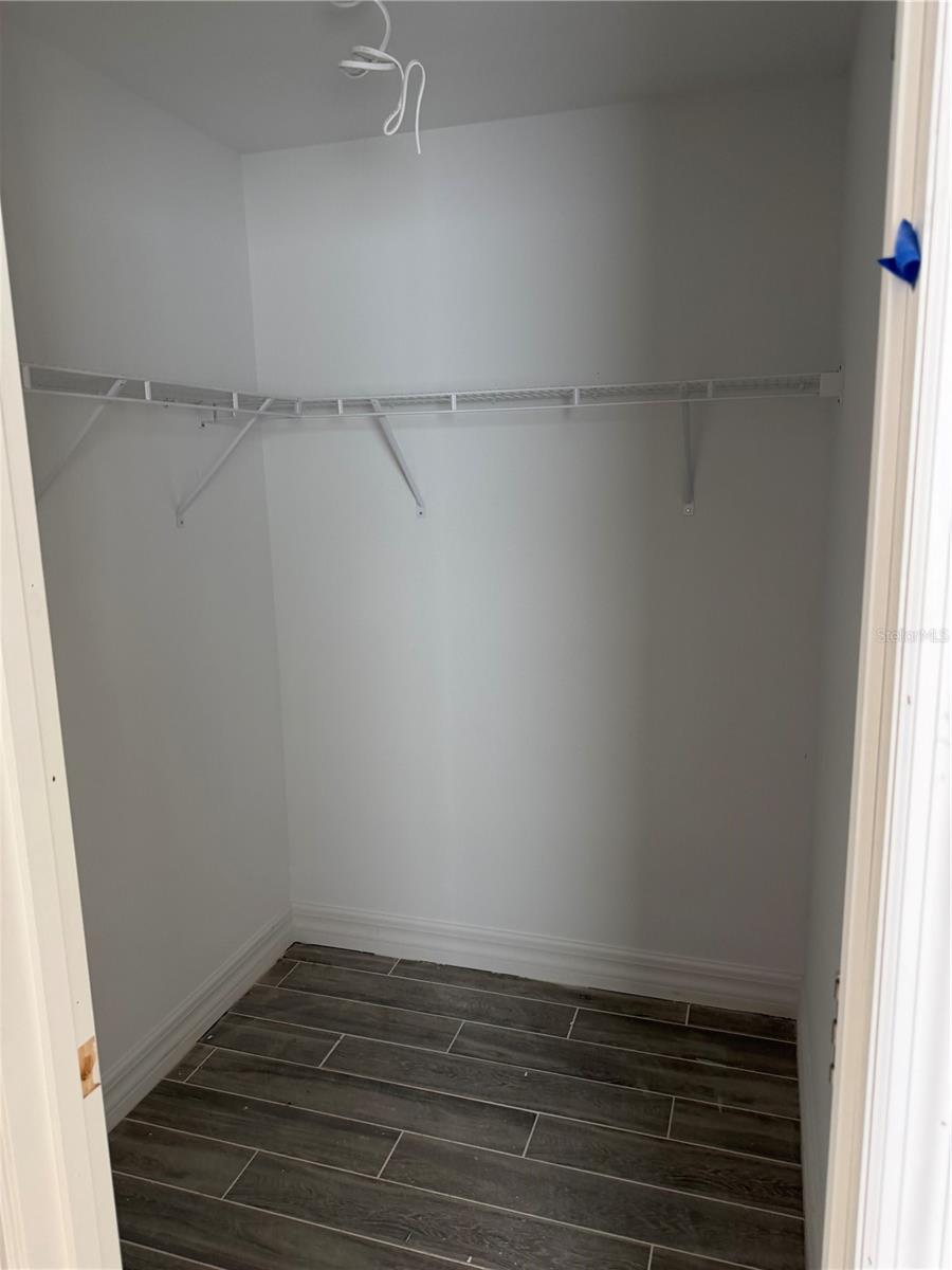 Primary walk-in closet - 15061 MCGRAW AVE, PORT CHARLOTTE
