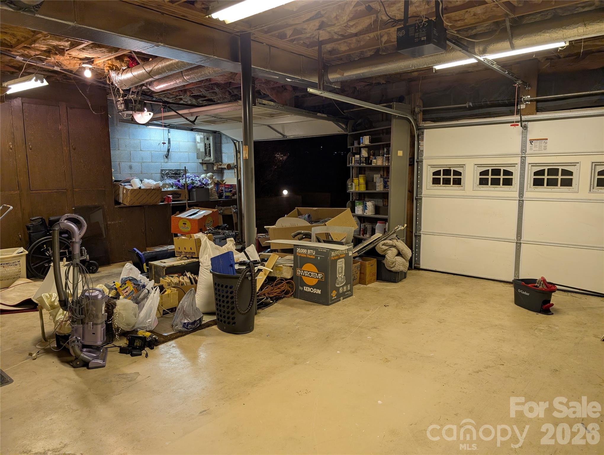 double garage with built in cabinets and work bench. Garage doors and openers replaced about 10 yrs ago with insulated doors - 3065 Woodstream Drive, Valdese