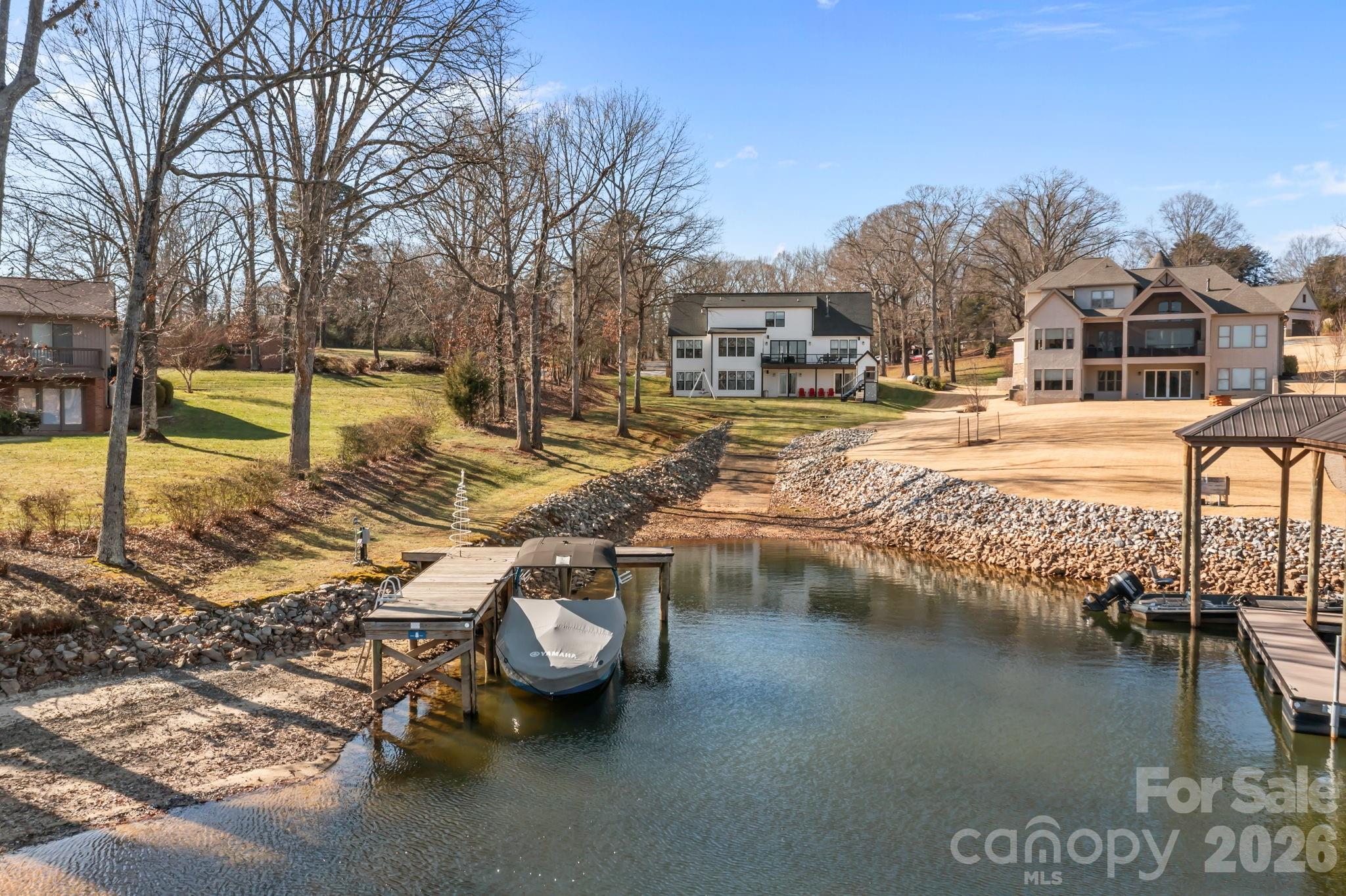 View of the home, dock, and boat ramp from the water - 5020 Slanting Bridge Road, Sherrills Ford
