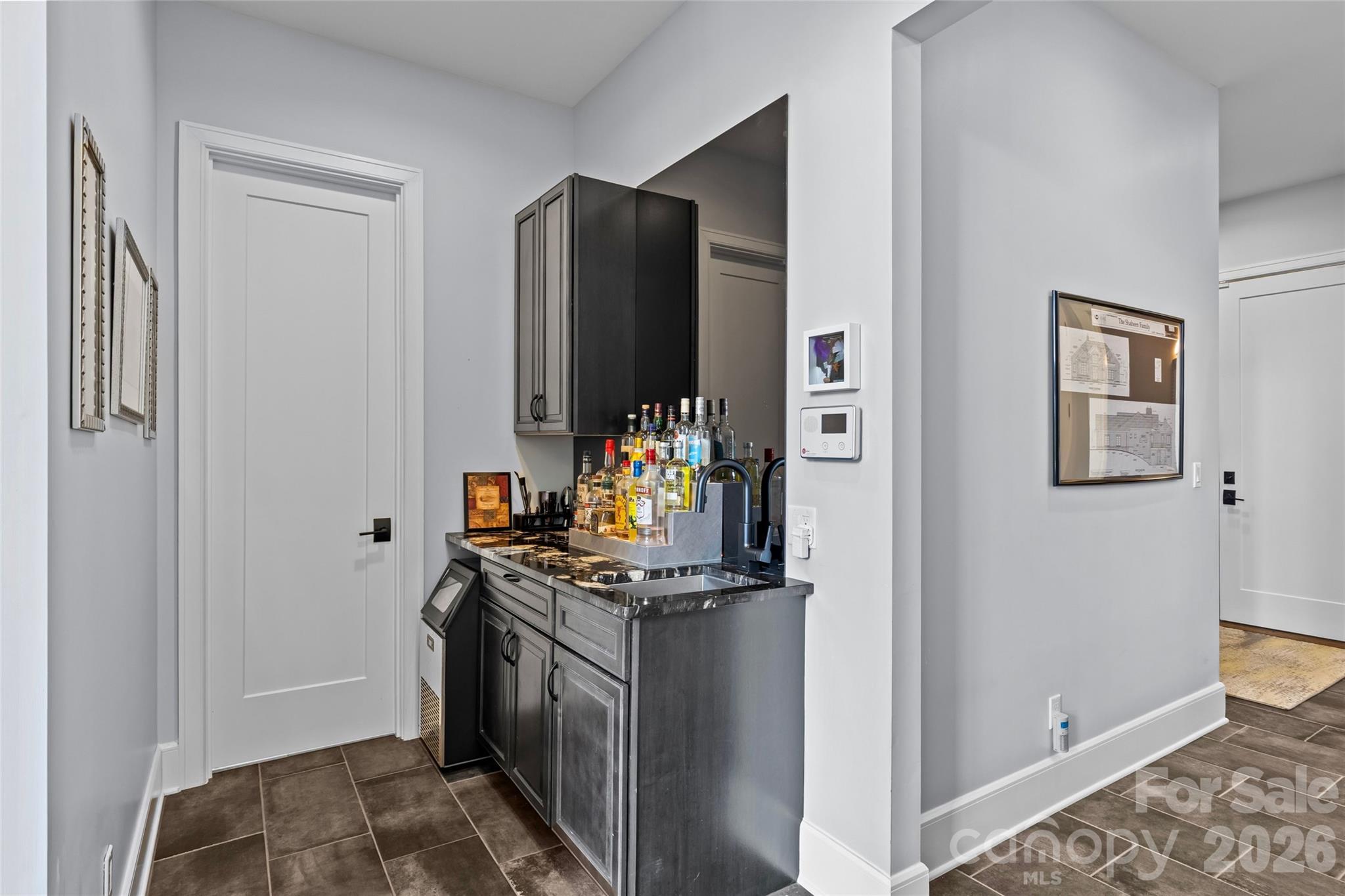 Stunning chef's kitchen has cherry & maple cabinets, granite countertops, oversized kitchen island, dual built-in stainless steel Frigidaire refrigerator & freezer, stainless steel appliances, prep sink in kitchen island with disposal, large butlers pantry with additional sink & dishwasher, & bar with ice maker. - 6032 Headlands Court, Belmont