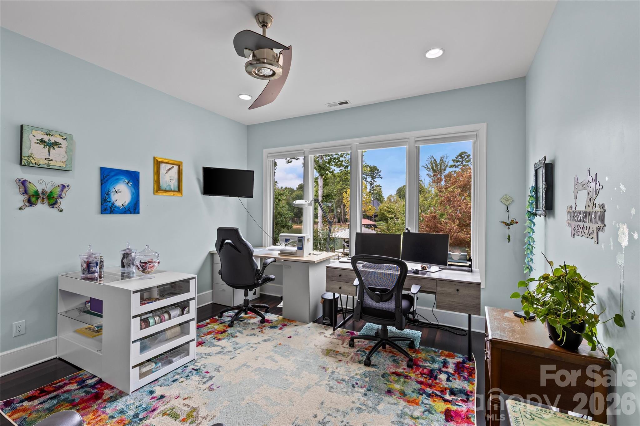 Lower level features an oversized family room with gas fireplace, 3 bedrooms, 2 full bathrooms, incredible walk in storage & sliding door access to the screened in porch. - 6032 Headlands Court, Belmont