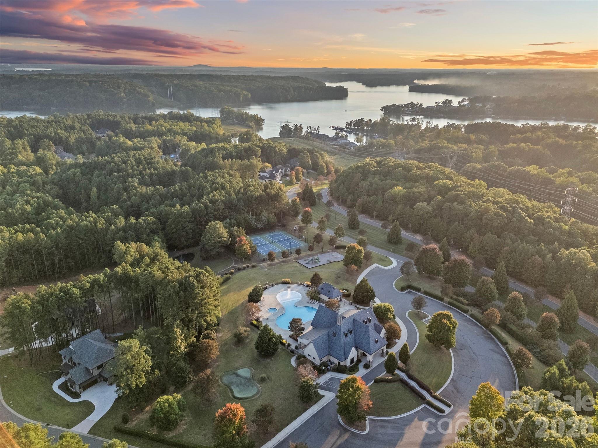 Neighborhood amenities include gated community, Lake Wylie waterfront, clubhouse, lagoon swimming pool, lighted tennis & pickleball courts, walking paths, beach area on Lake Wylie, playground, boat storage, boat slips, boat launch canoe, kayak dock & storage & pavilion. - 6032 Headlands Court, Belmont