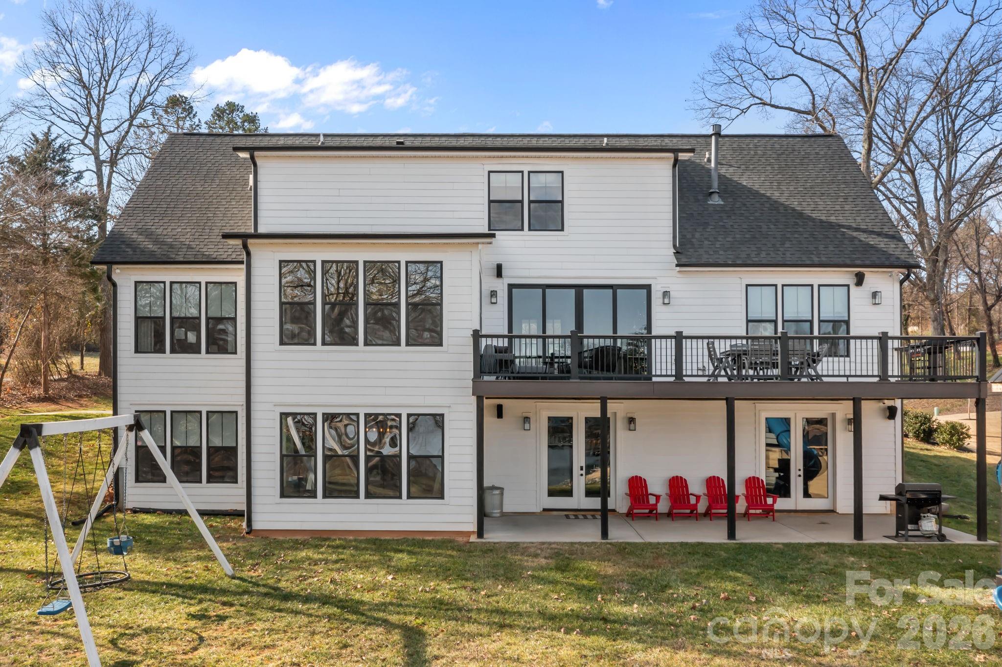 Backyard exterior. facing the lake - 5020 Slanting Bridge Road, Sherrills Ford