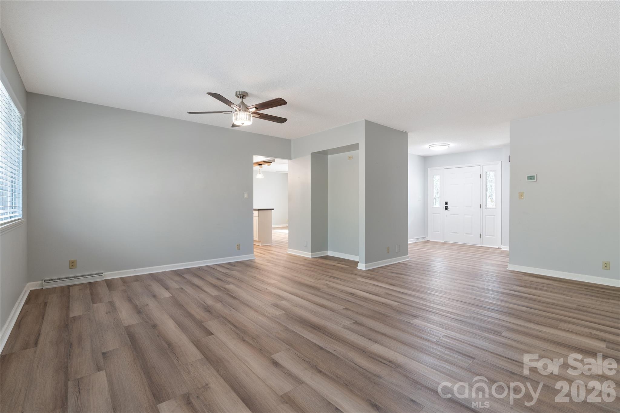 Large living room into Entry - 177 Country Road, Brevard