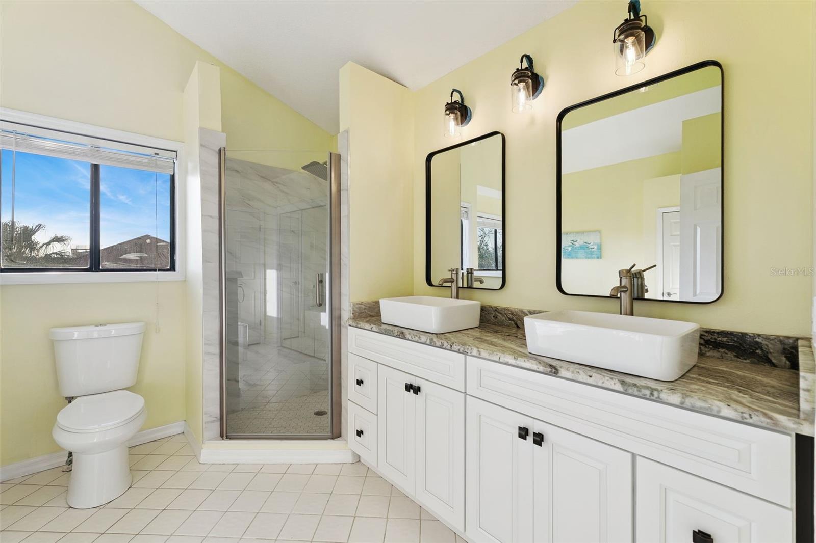 Primary bathroom features an updated shower - 6455 ENGRAM RD, NEW SMYRNA BEACH