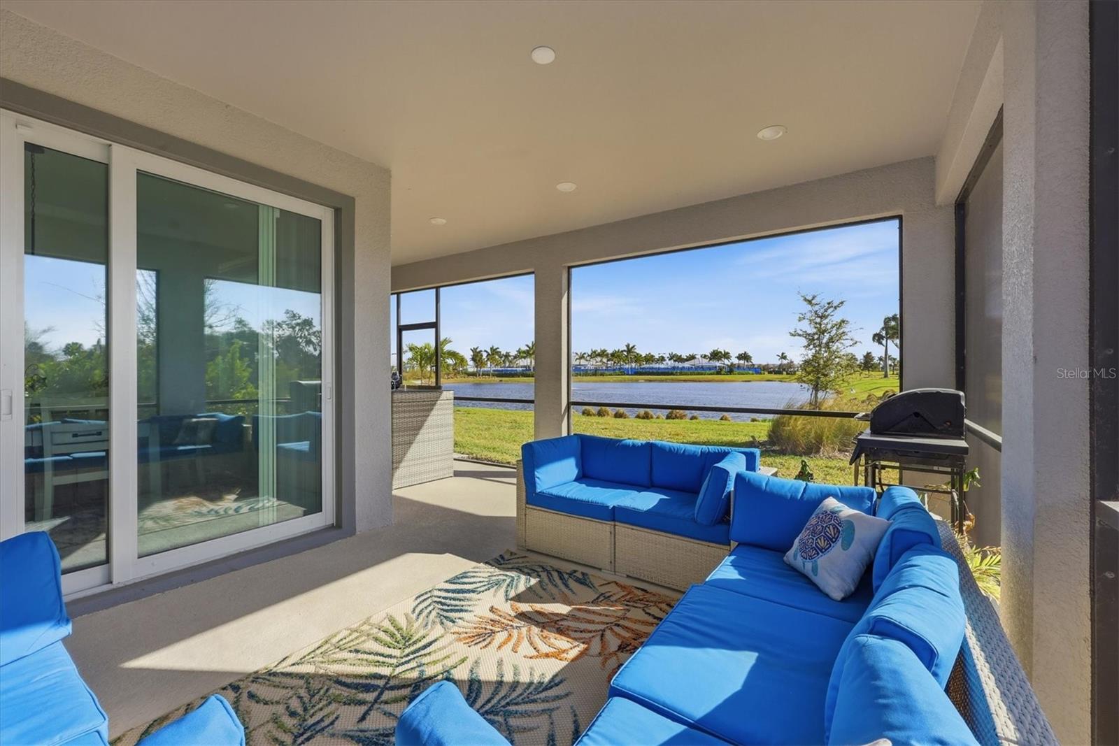Impact sliders and lovely pond view from the covered lanai - 8705 COASTAL KEY WAY, PARRISH