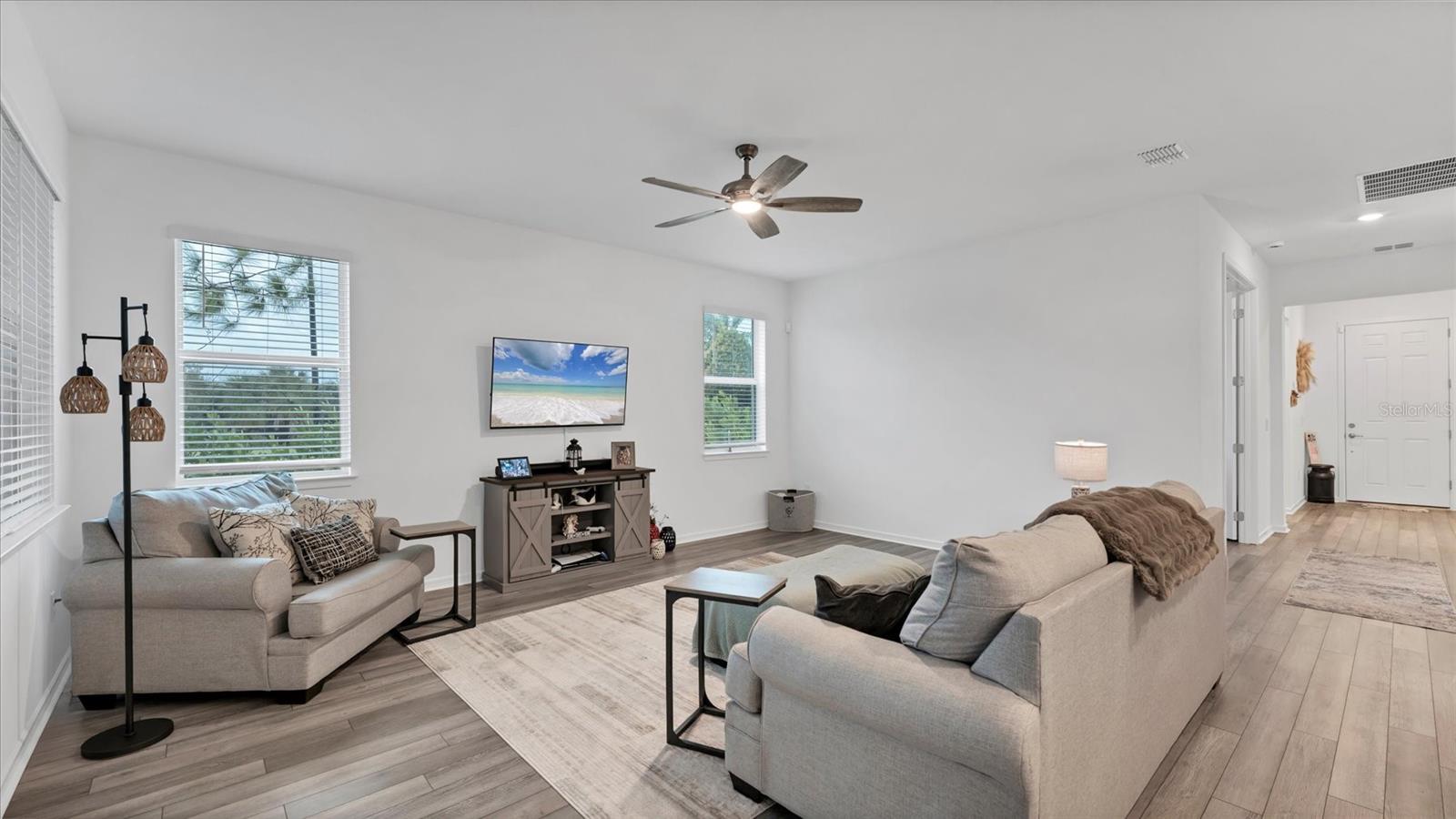 While the home is sited on a corner lot, it is very private due to the landscaping - 8705 COASTAL KEY WAY, PARRISH