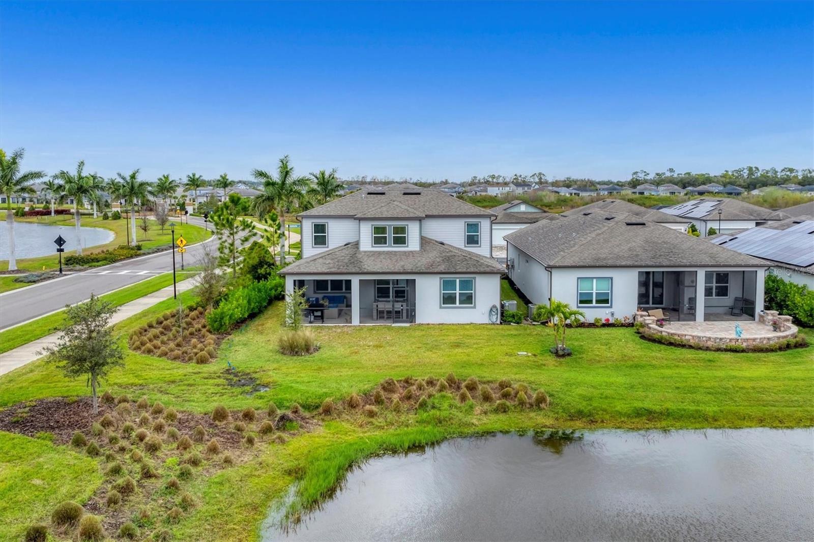 Rear of home has significant space for a pool or extended lanai - 8705 COASTAL KEY WAY, PARRISH