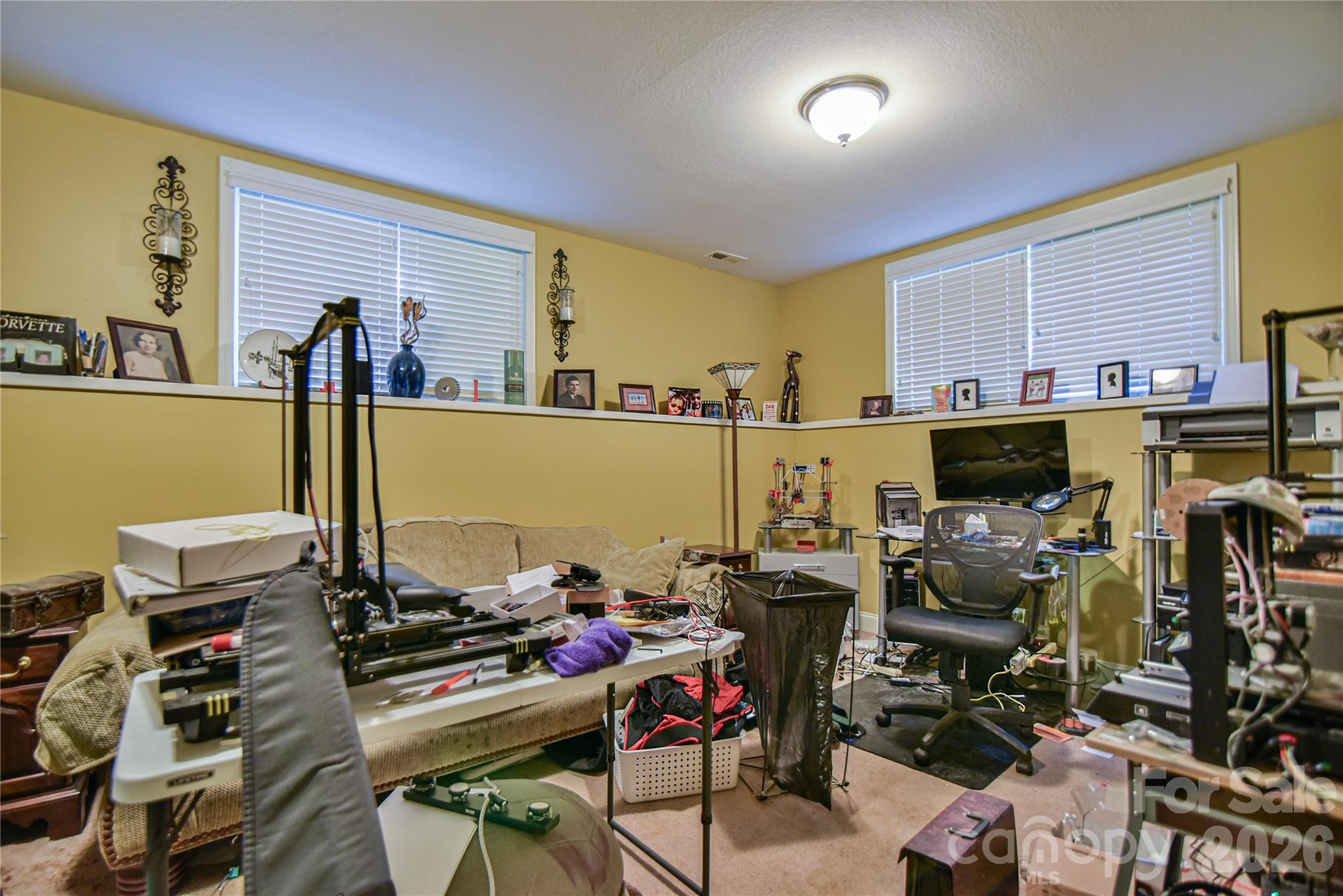 Lower level den/office or living space currently being used as the hobby shop. - 911 Fanning Bridge Road, Fletcher