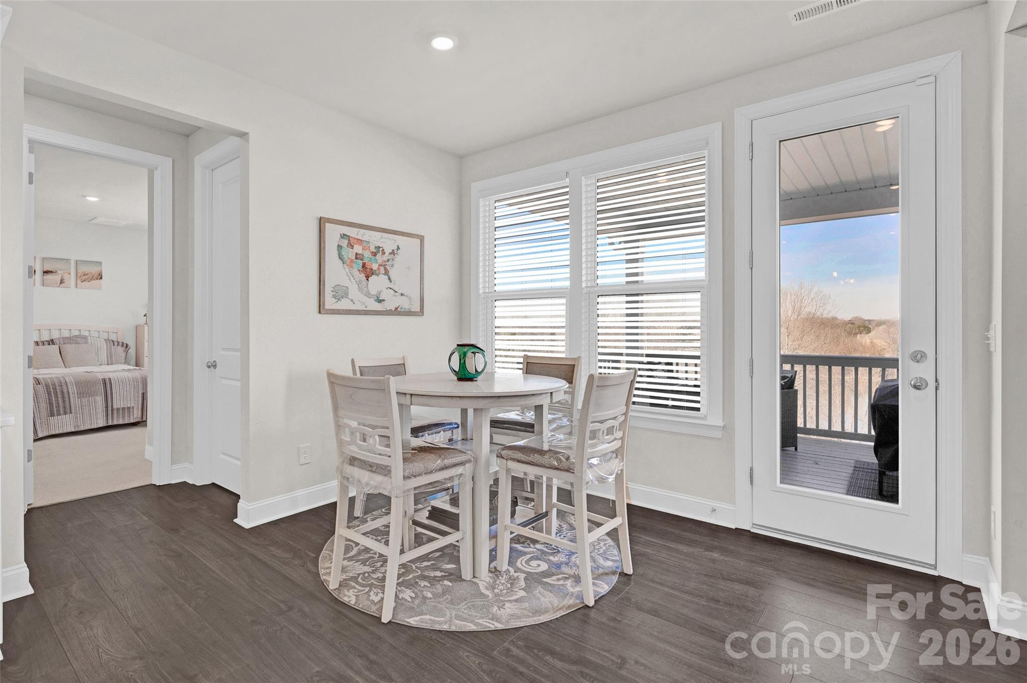 Breakfast area overlooking the back yard and dock - 309 W Waterlynn Road, Mooresville
