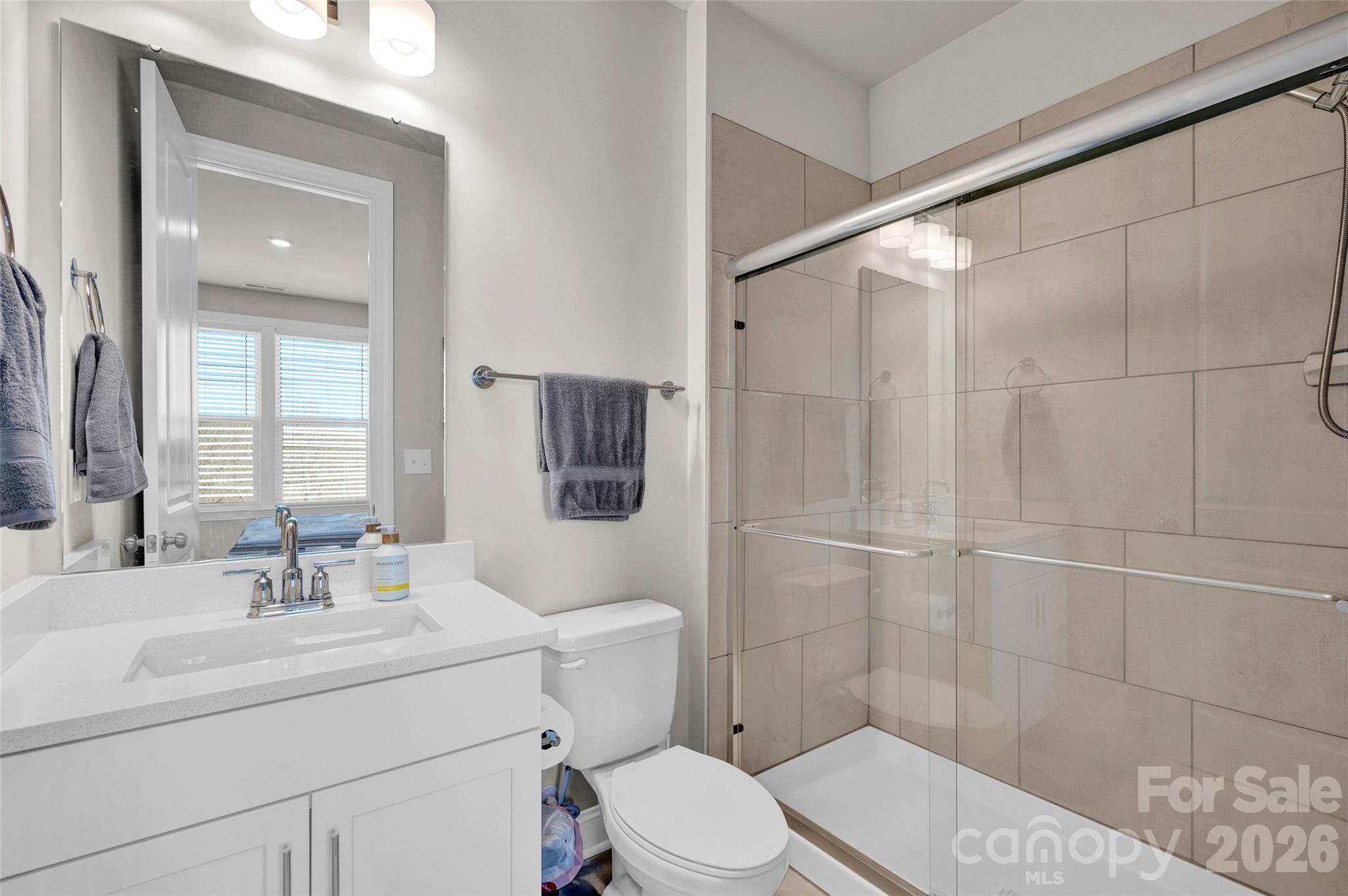 Guest bath on the main level as well as a 1/2 bath - 309 W Waterlynn Road, Mooresville