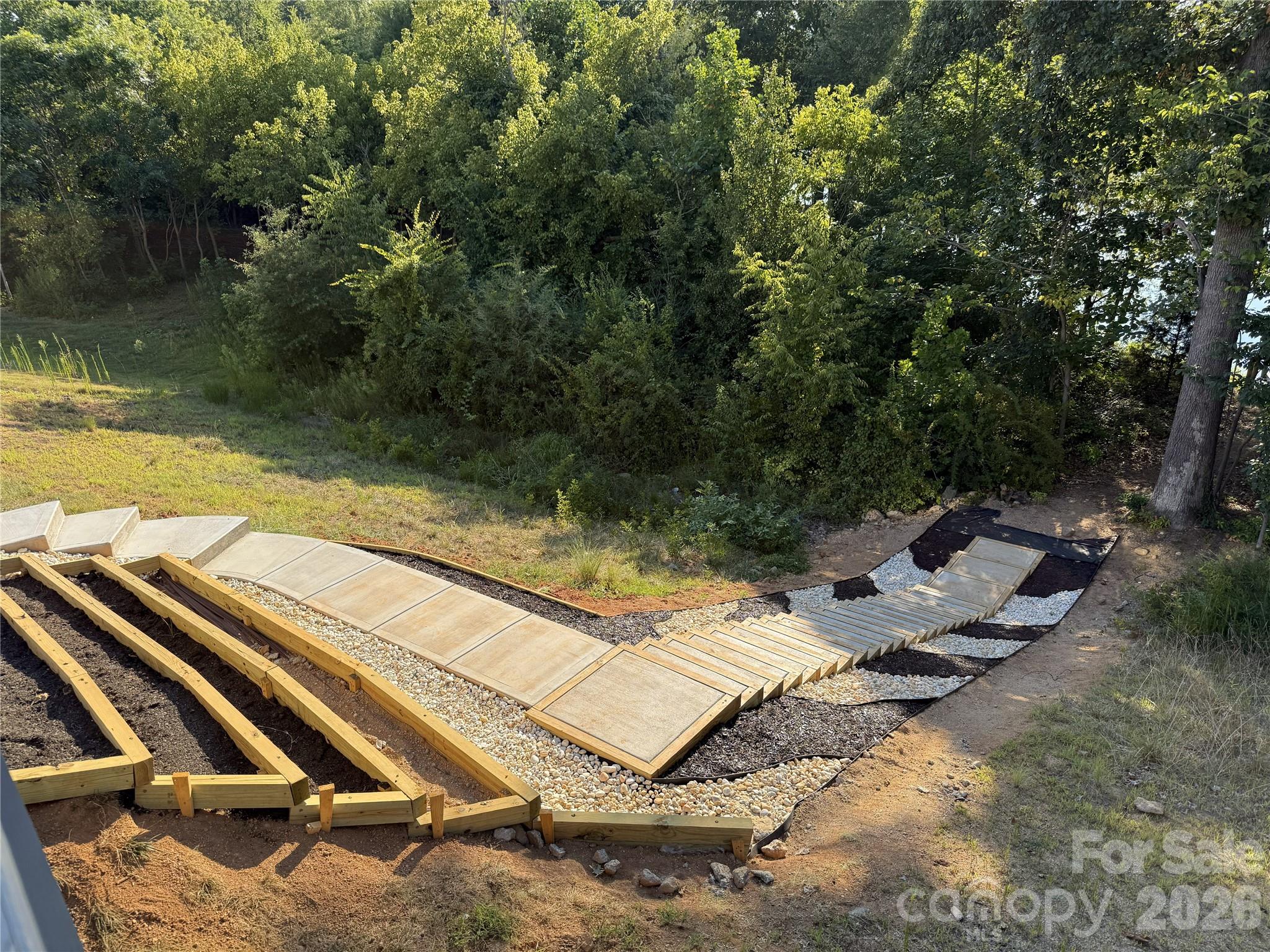 New stairway to the dock with planting beds - 309 W Waterlynn Road, Mooresville