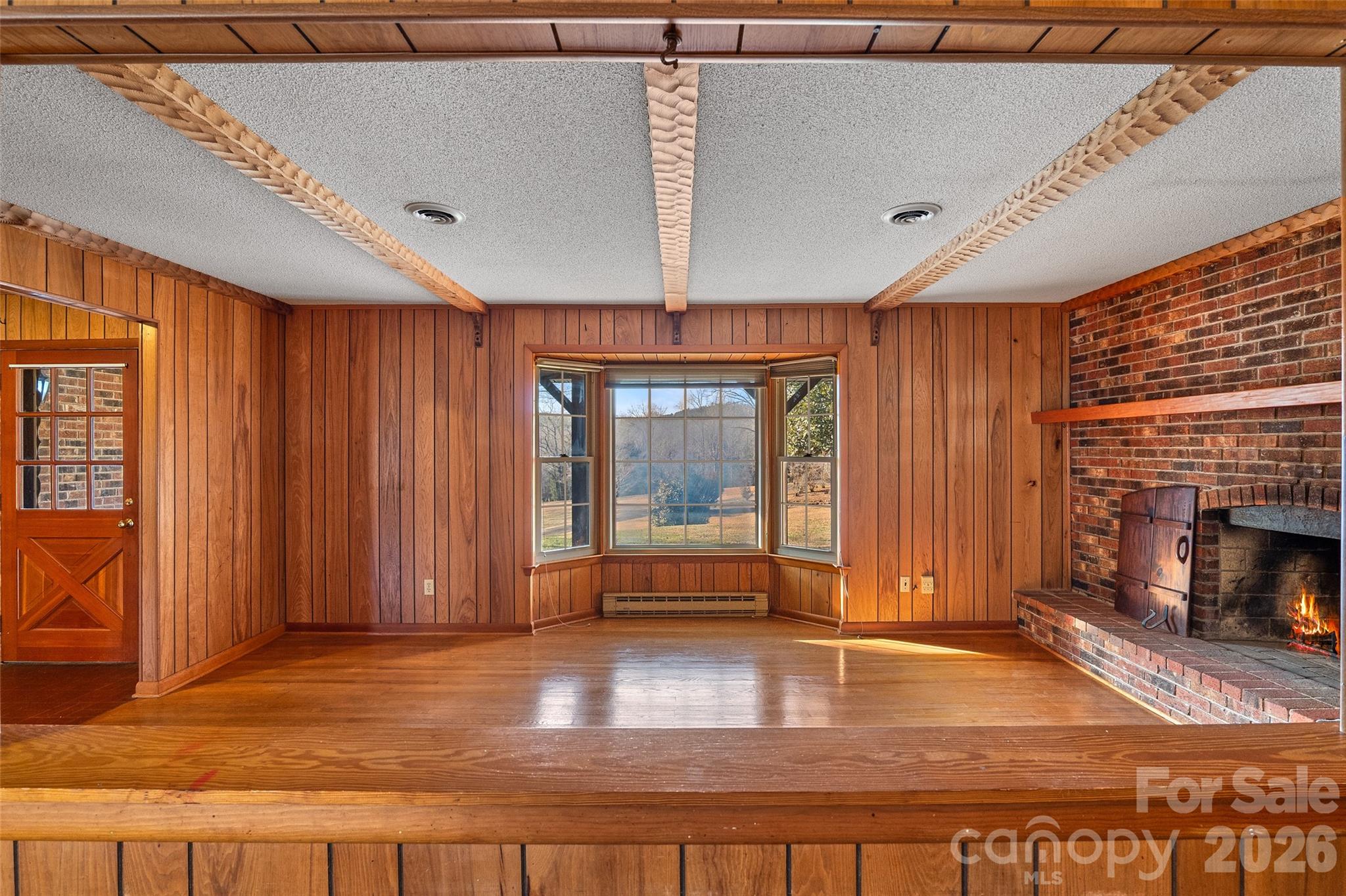 Passthrough window from kitchen to living room. Entry door from front porch to left. - 591 Landrum Road, Columbus