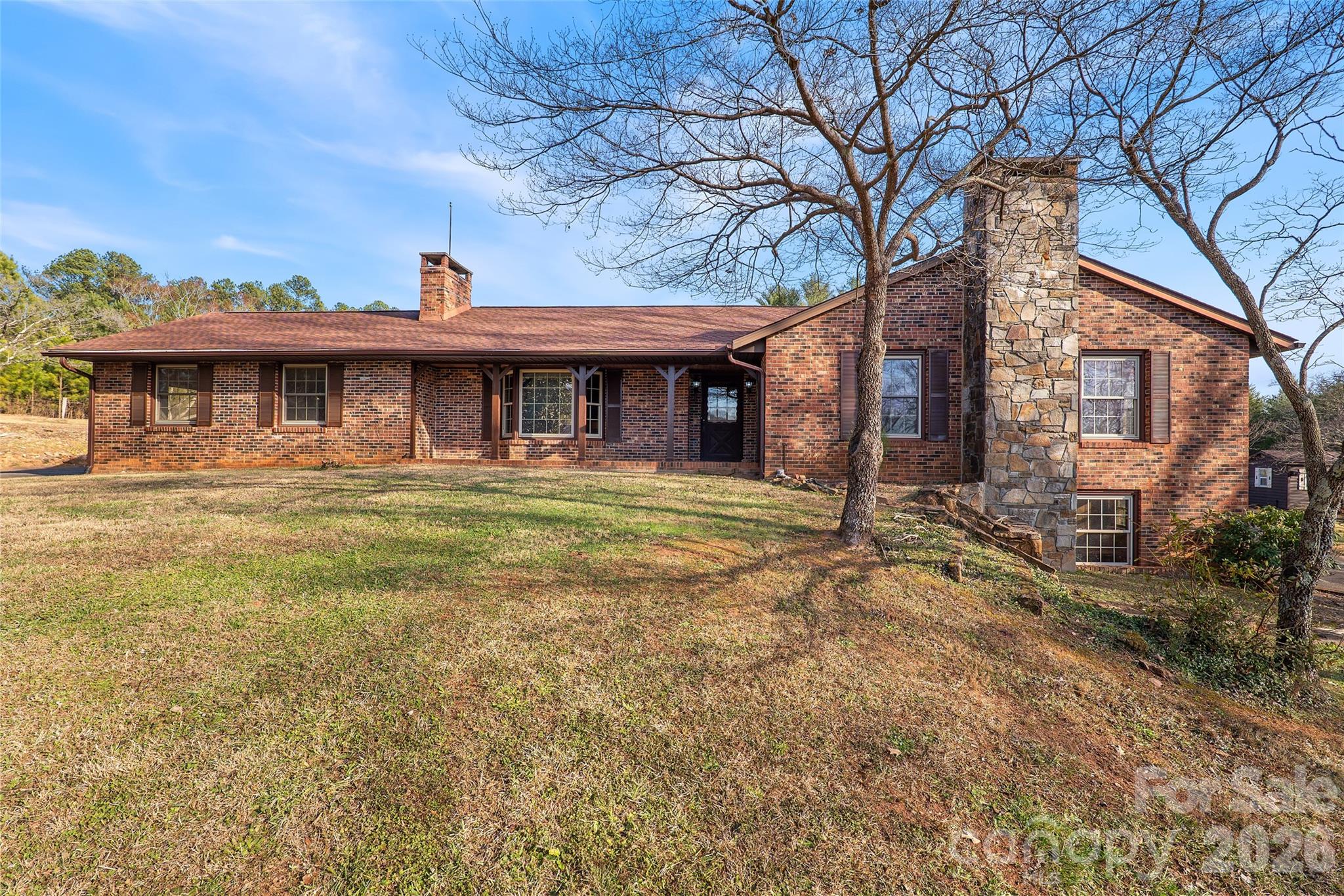Front view of all brick home with impressive rock fireplace - 591 Landrum Road, Columbus