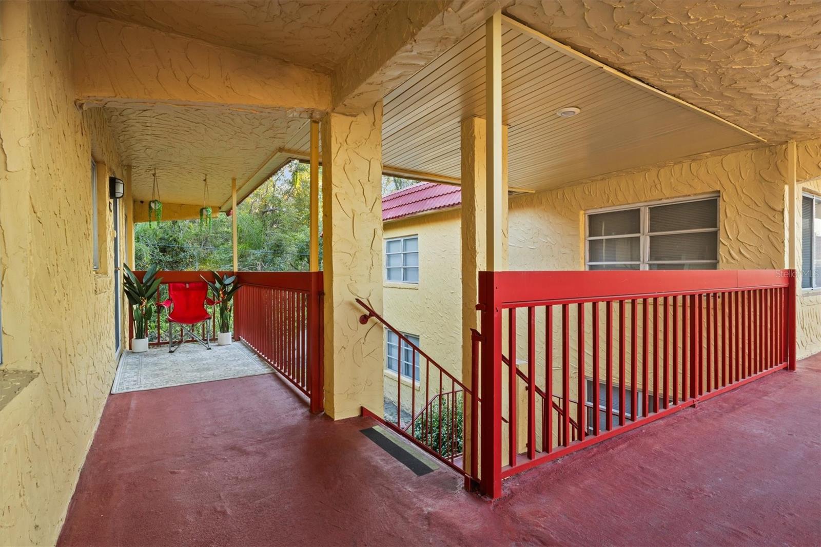 Covered entrance and stairway - 400 EL CAMINO DR #210, WINTER HAVEN