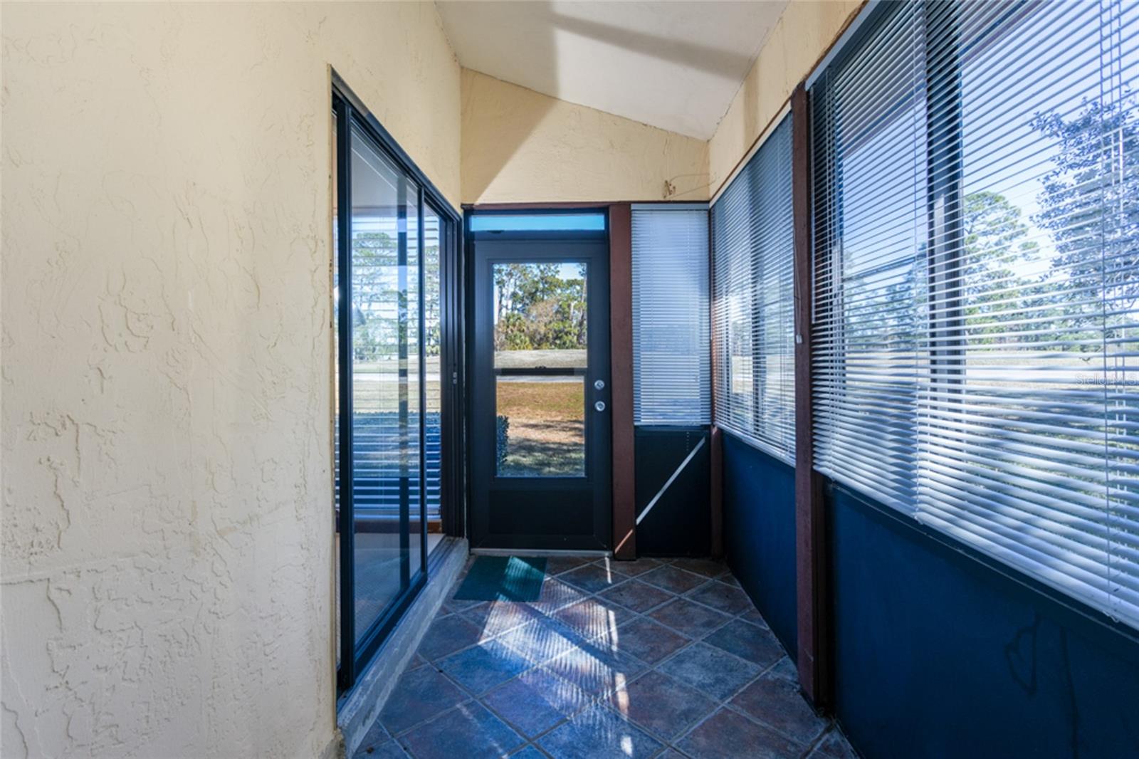 Covered Porch off of the Living Room - 39 VILLAGE CIR #5-501, PALM COAST