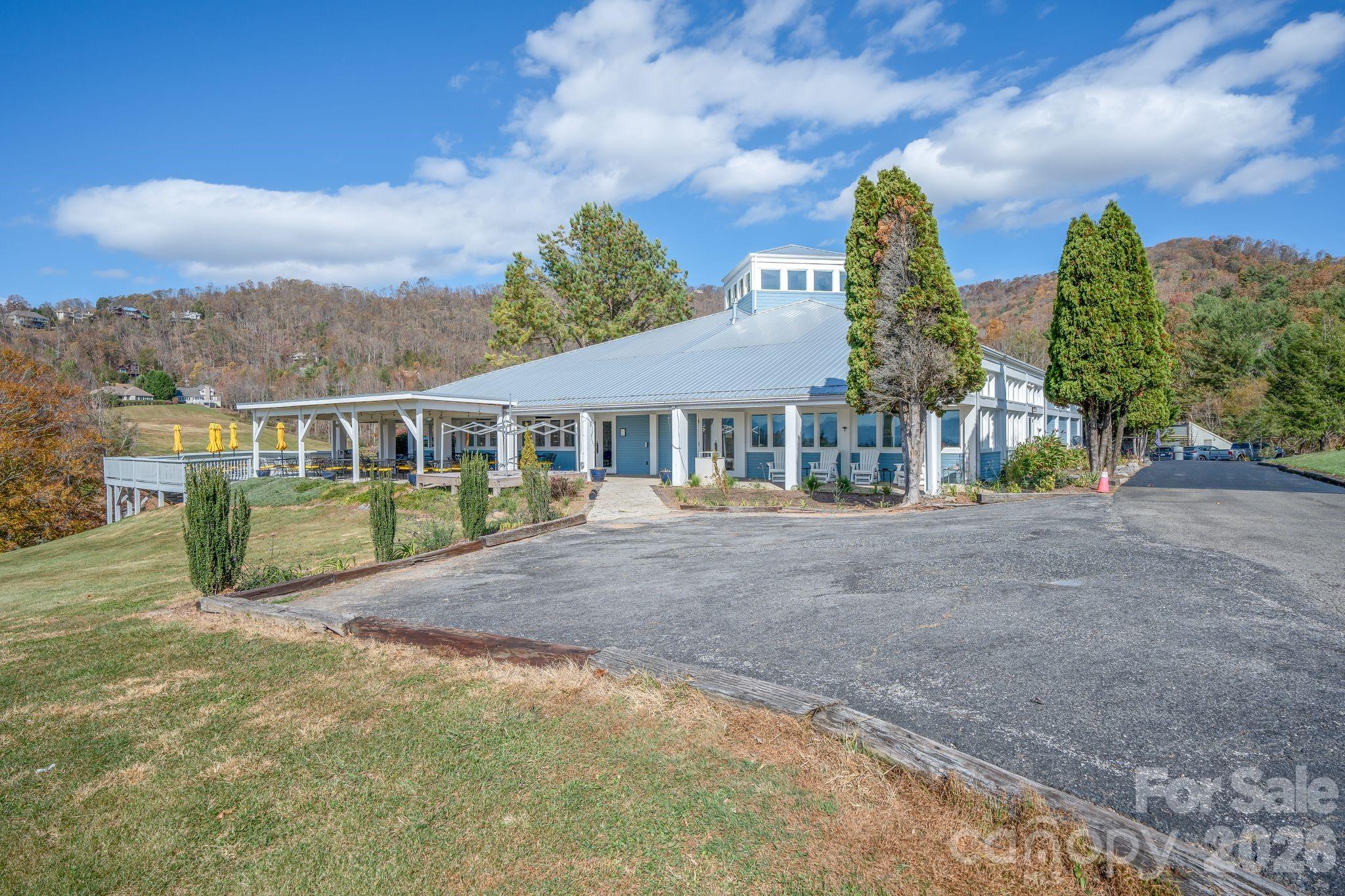 Rear view of Club House and Deck - 66 HawTree Court, Weaverville