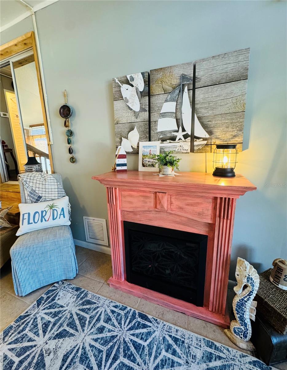 Fireplace in Florida Room - 411 ST GEORGE DR, DAVENPORT