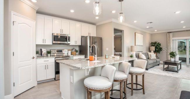 Model home - actual features may vary. - 57 ENCLAVE AVE, PALM COAST