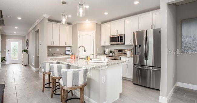 Model home - actual features may vary. - 57 ENCLAVE AVE, PALM COAST