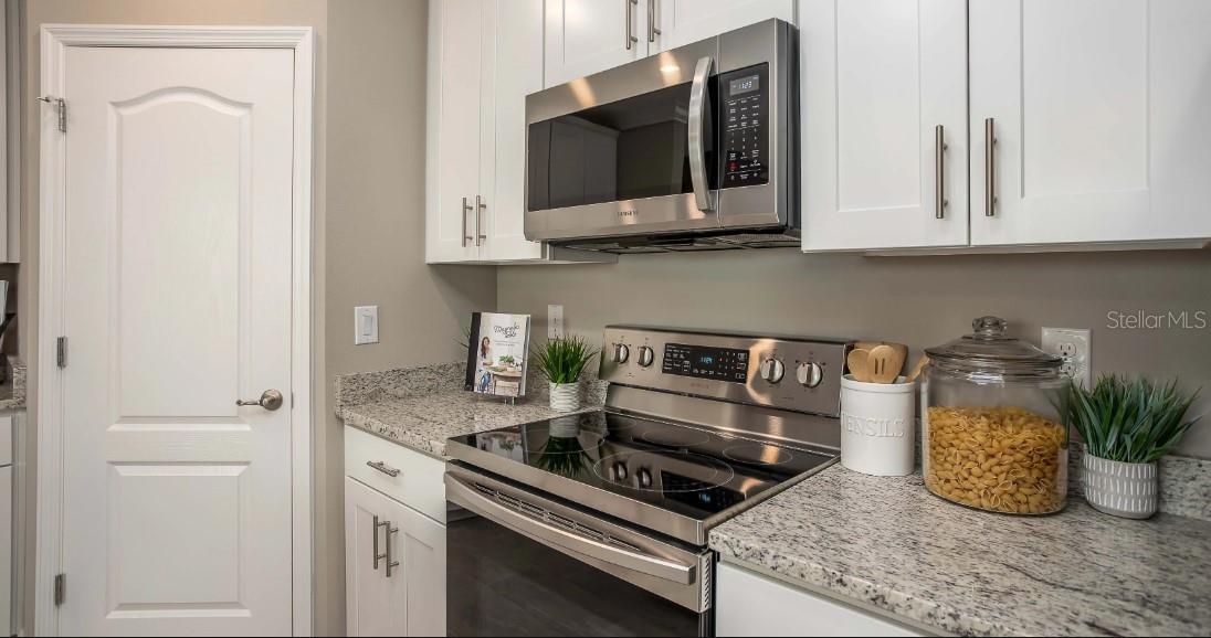 Model home - actual features may vary. - 57 ENCLAVE AVE, PALM COAST