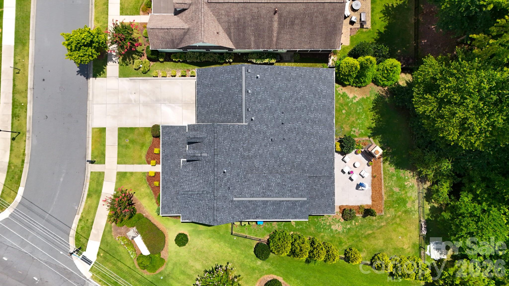 Large tree buffer and wide side yard offer additional privacy and space from the road with a premium location near the front of the subdivision. - 2702 Arsdale Road, Waxhaw