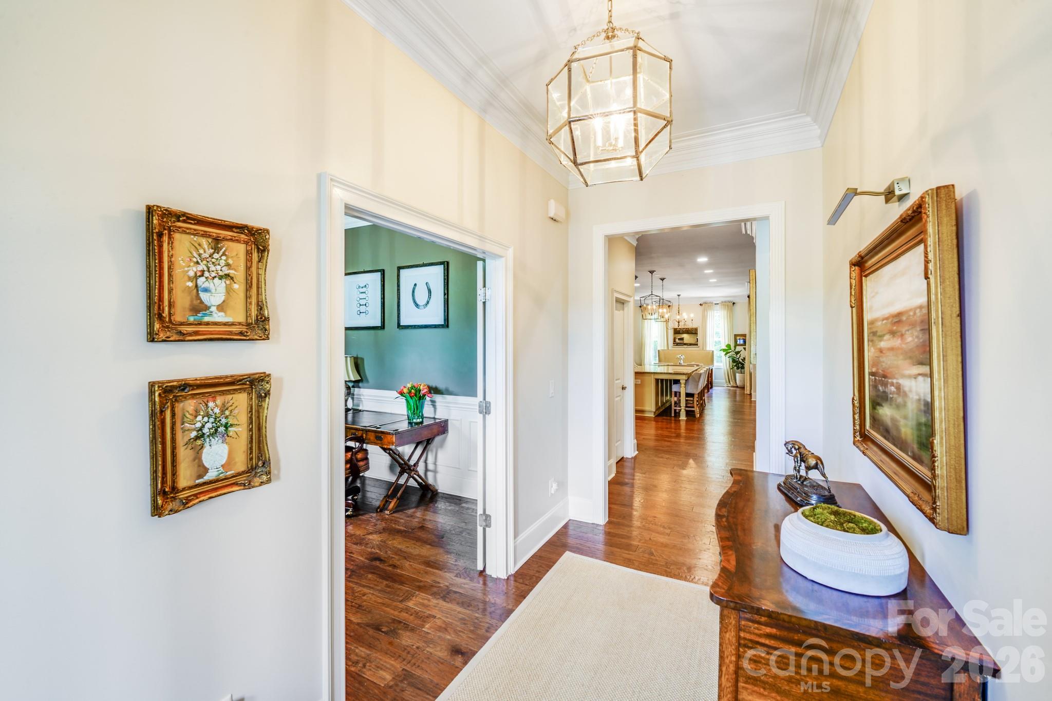 This elegant home features a wide foyer with crown molding and tall ceilings that create a sense of grandeur - 2702 Arsdale Road, Waxhaw