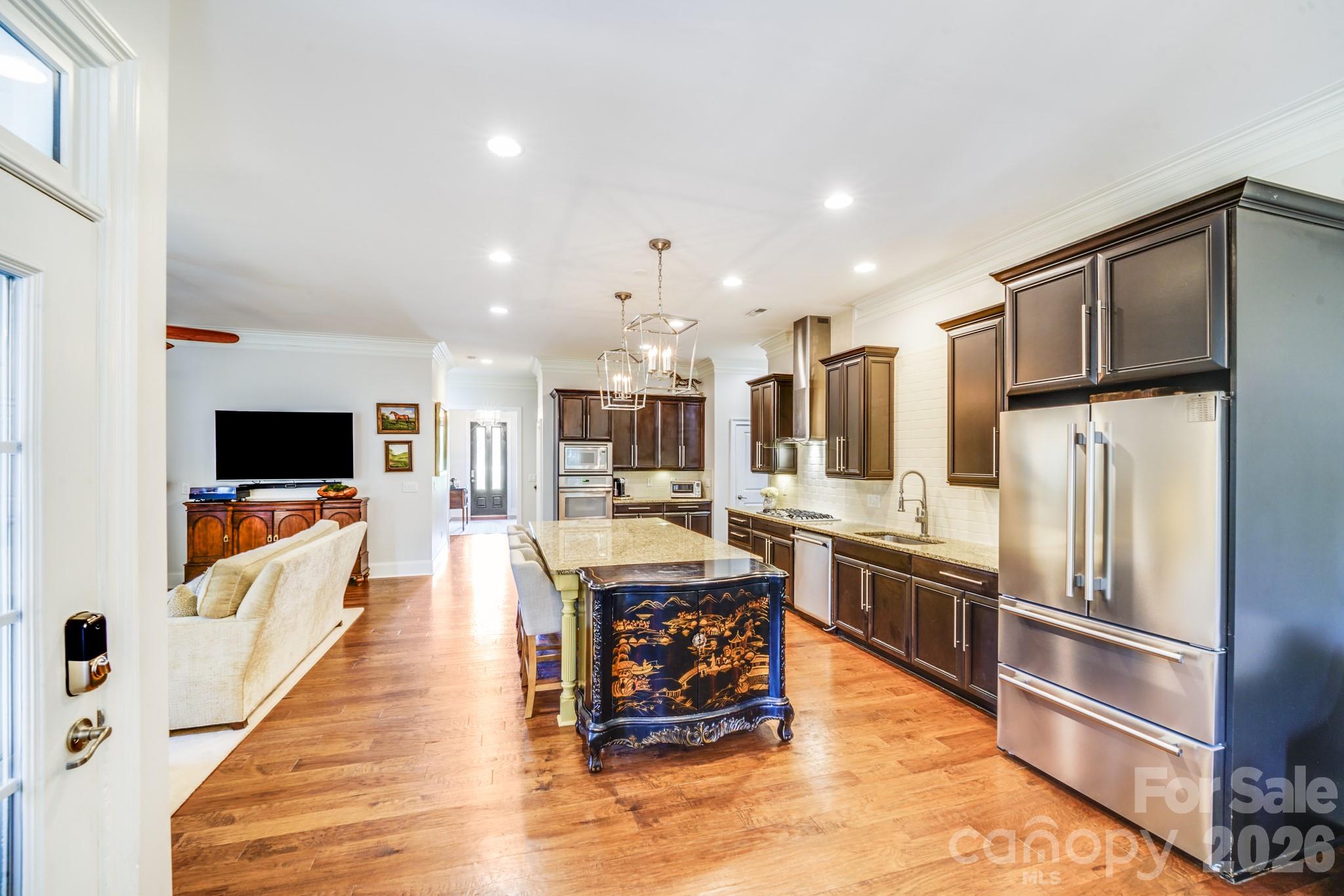Kitchen and living area exude luxury, practicality, and charm—all signature elements of a Cunnane-built home. - 2702 Arsdale Road, Waxhaw