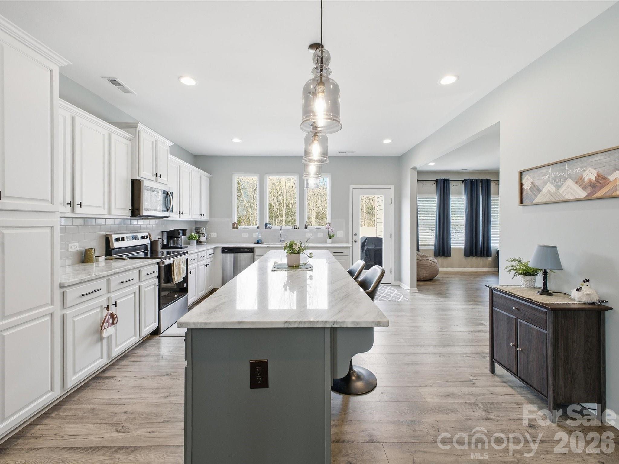 Kitchen w/oversized Quartzite island - 1049 River Haven Avenue SW, Concord