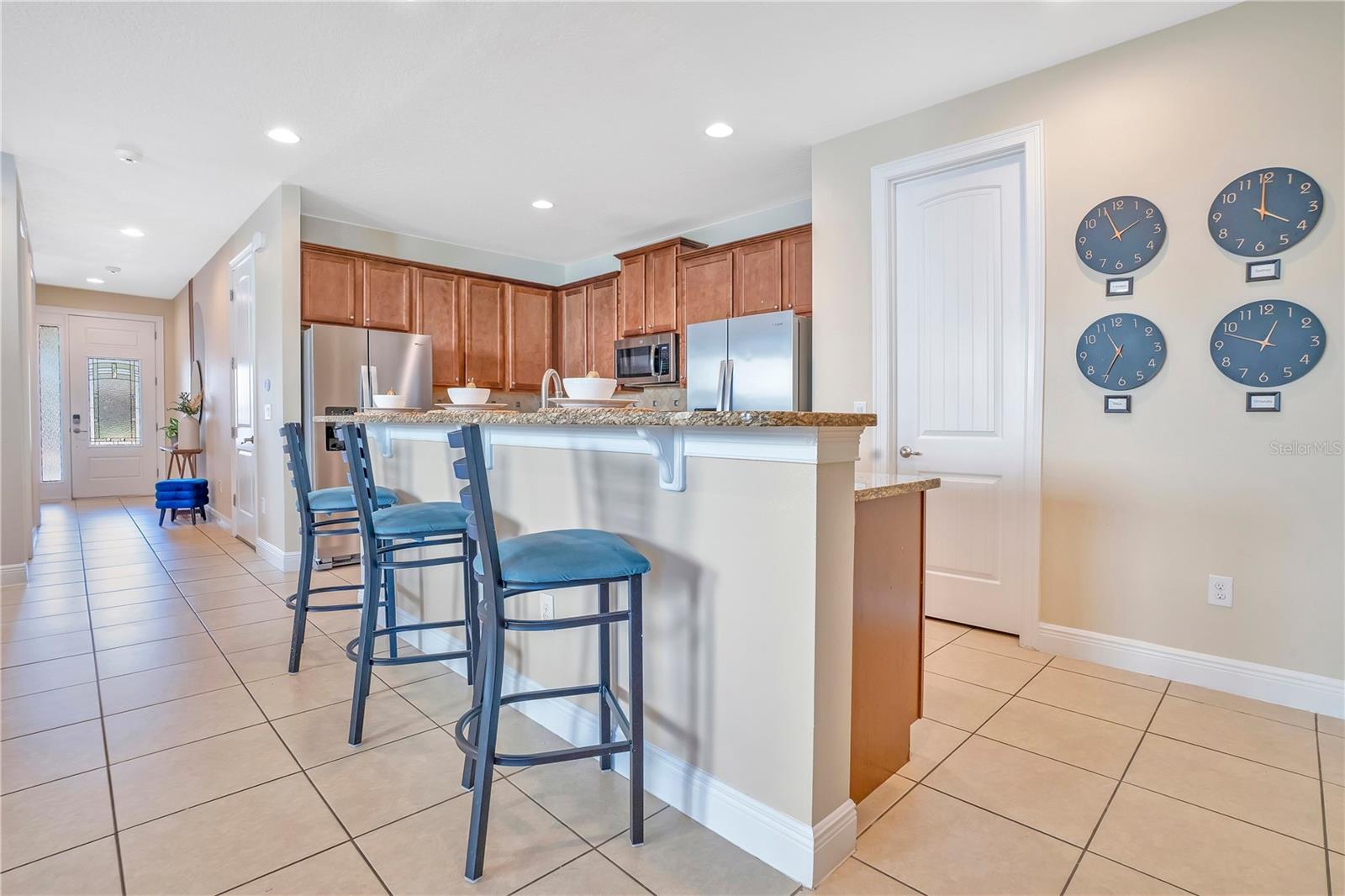Open-concept living space with seamless flow to dining and kitchen—ideal for entertaining larger groups. - 631 LASSO DR, KISSIMMEE