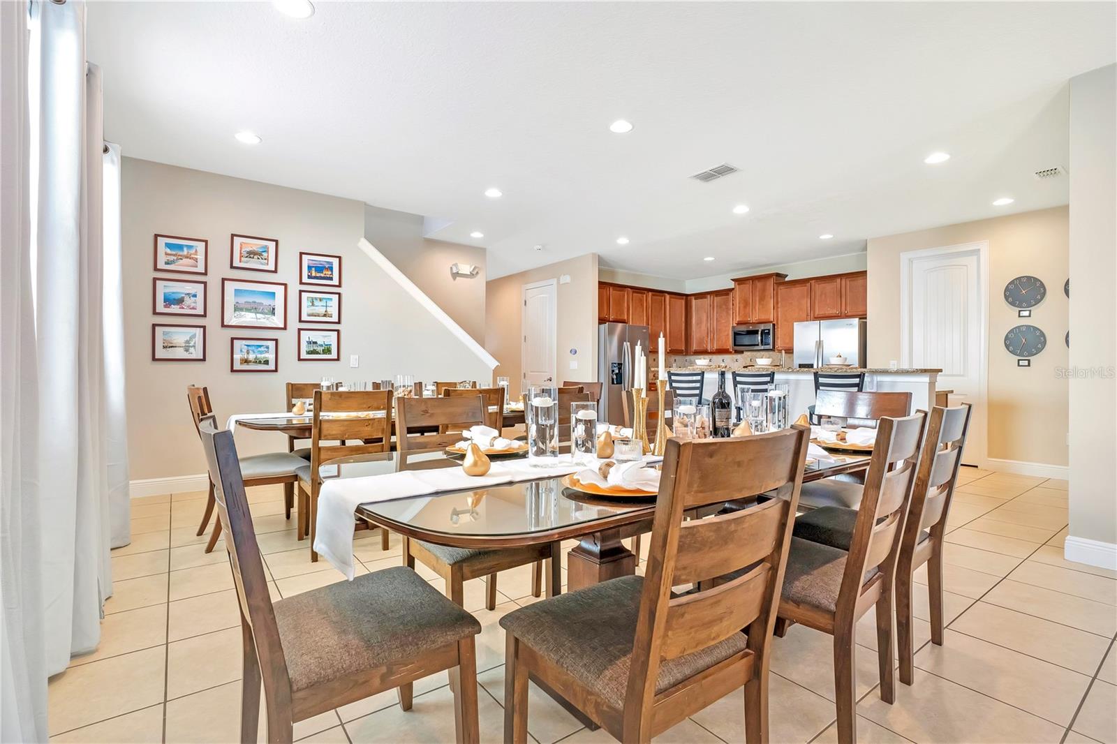 Large dining space designed to comfortably accommodate group meals and gatherings. - 631 LASSO DR, KISSIMMEE