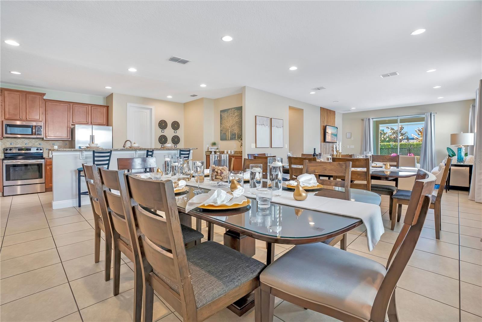 Bright, open dining area with direct access to the main living space. - 631 LASSO DR, KISSIMMEE