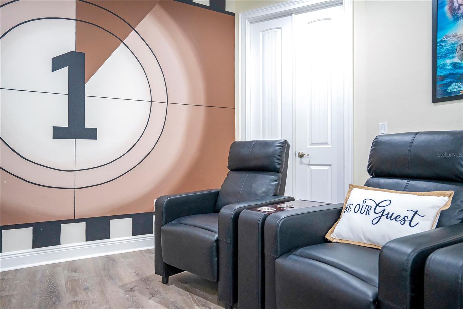 Comfortable recliner seating creates a true cinematic experience at home - 631 LASSO DR, KISSIMMEE
