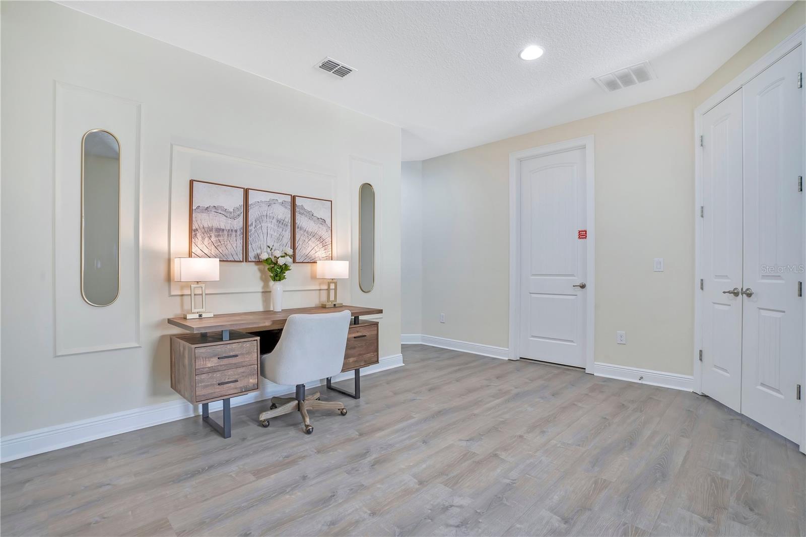 Spacious upper-level loft offering additional gathering or workspace flexibility - 631 LASSO DR, KISSIMMEE