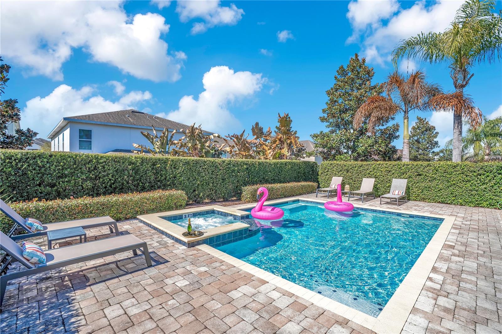 Resort-style screened pool area offering privacy, sunshine, and seamless indoor-outdoor living - 631 LASSO DR, KISSIMMEE