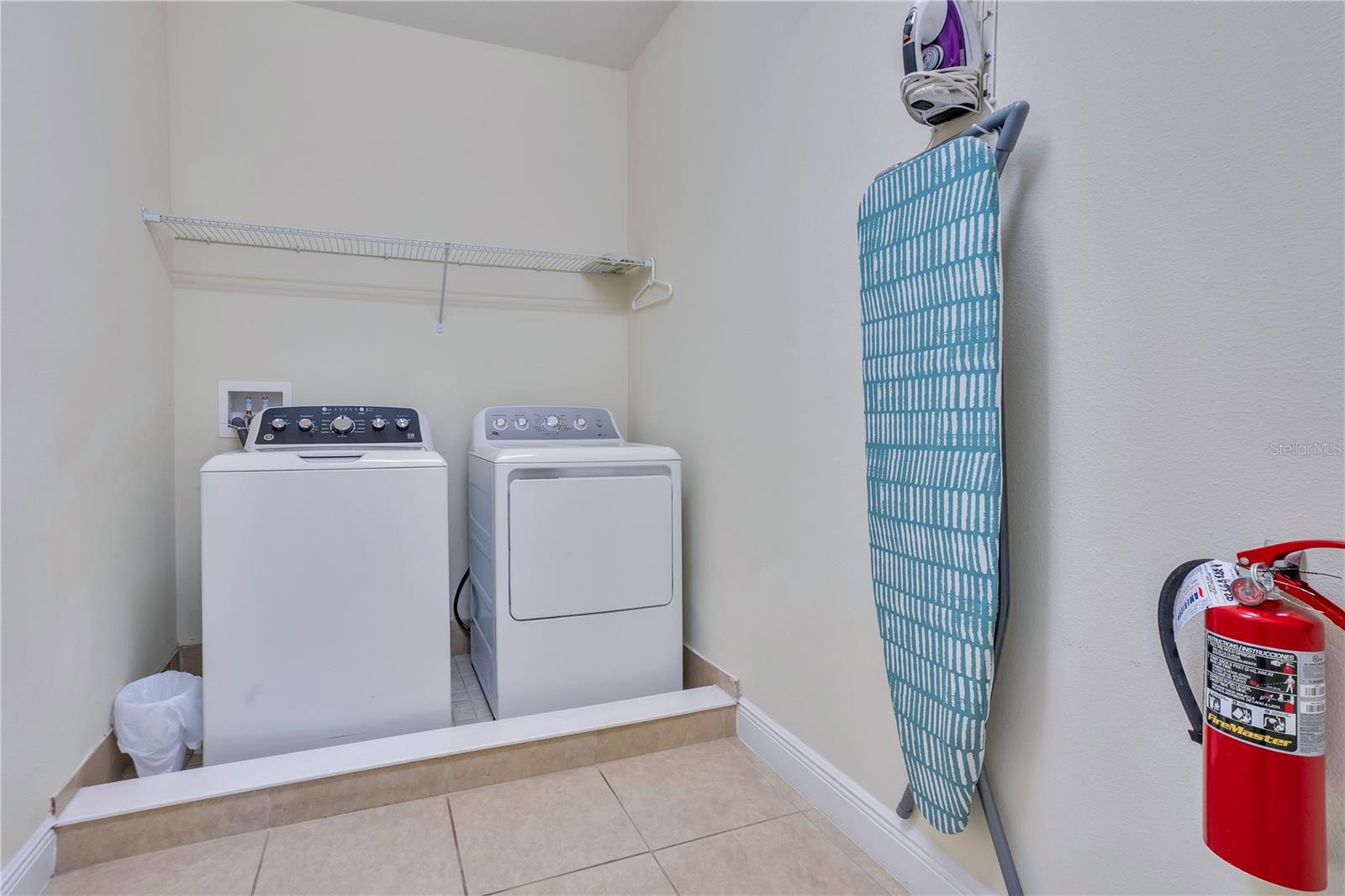 Convenient upstairs laundry room providing added functionality for large groups and extended stays - 631 LASSO DR, KISSIMMEE