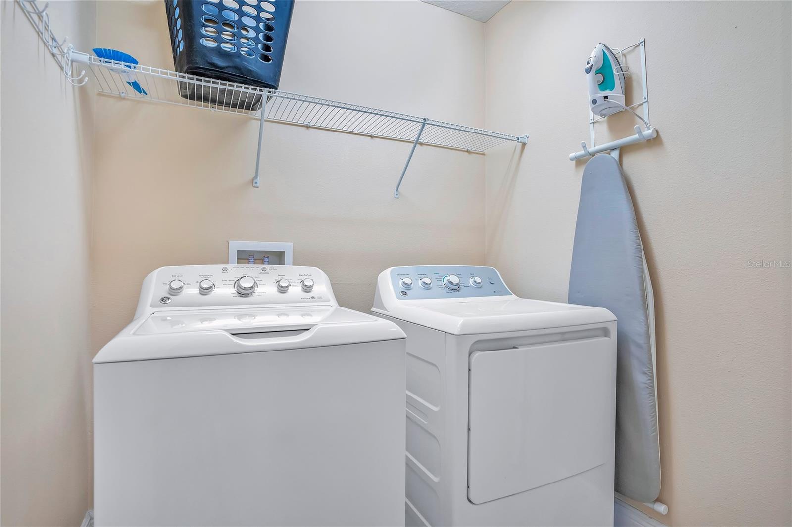 Additional downstairs laundry area to support high-occupancy rental performance and guest convenience - 631 LASSO DR, KISSIMMEE